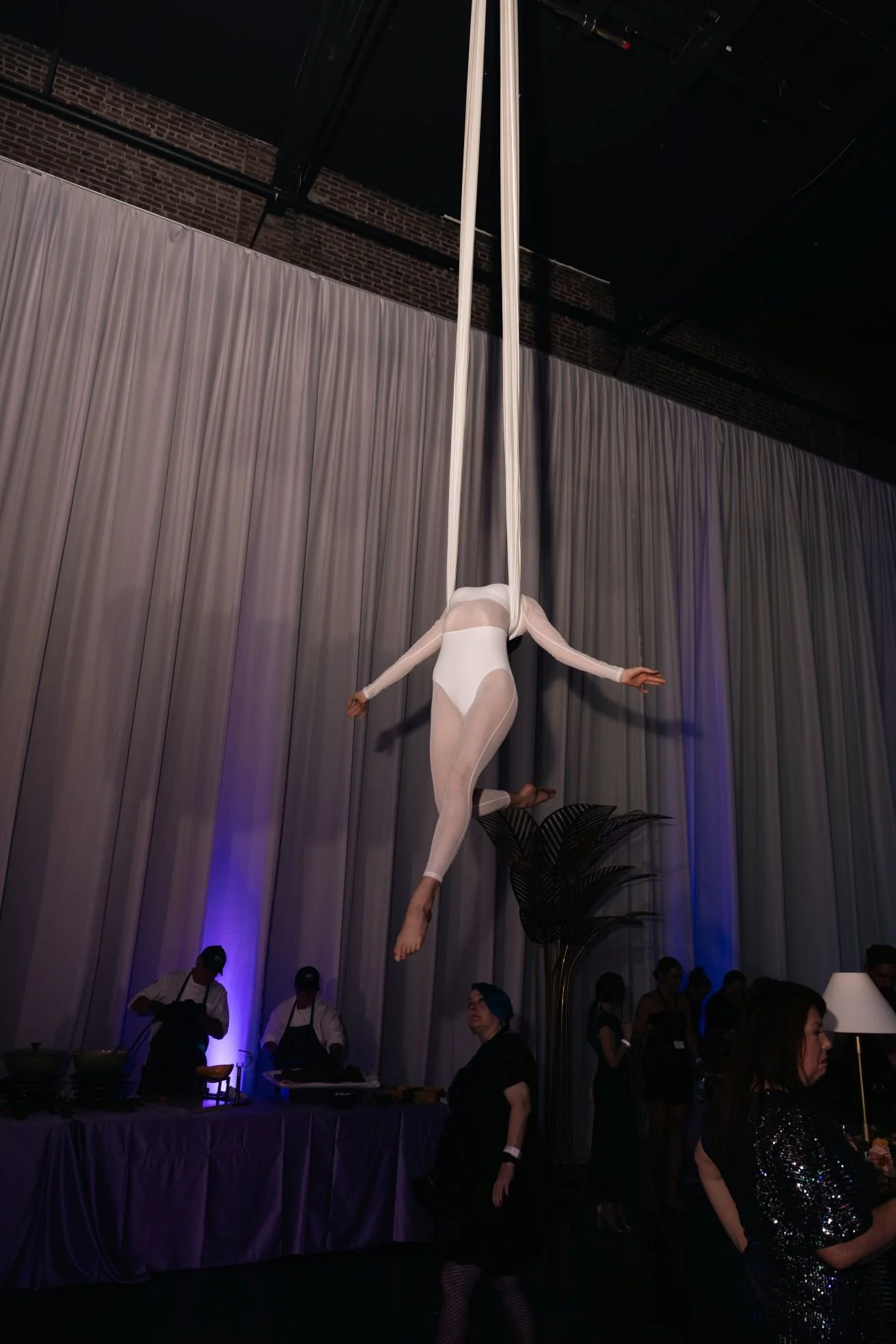 Silhouetted Aerialist in White