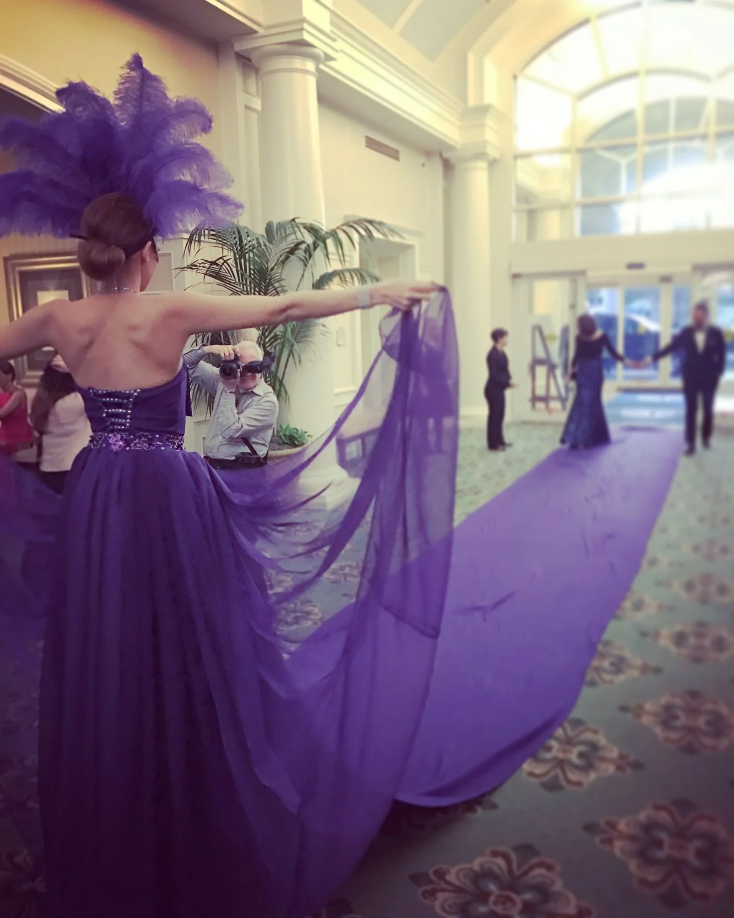 Purple Carpet Performer Greets Guests Indoors