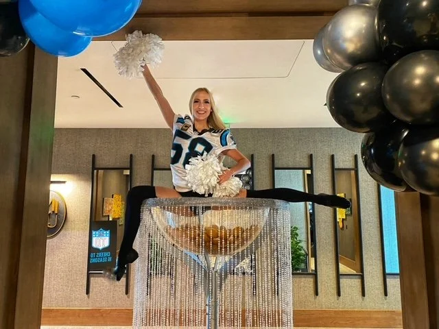 Sports-Themed Martini Glass Performer in Jersey and Pom Poms