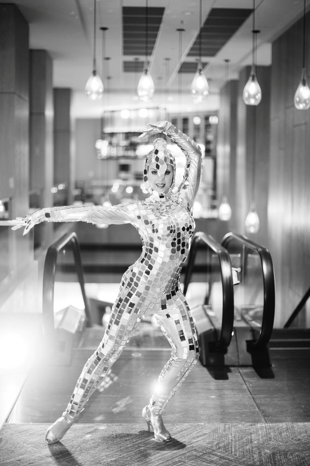Mirror Girl at Escalator Entrance