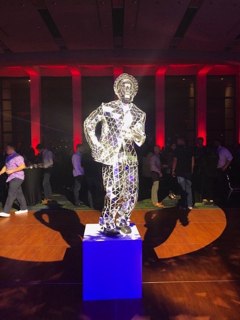 Mirror Man on Blue Podium