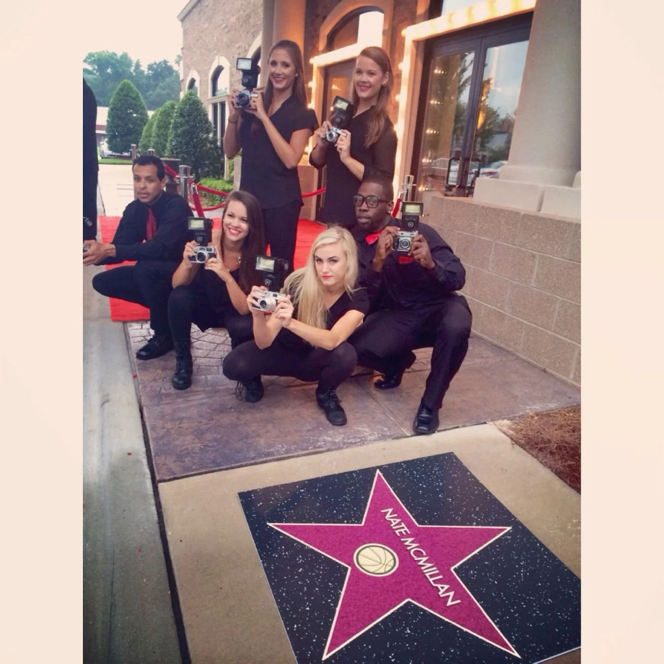 Paparazzi Team Posed for Arrival by a Hollywood Star