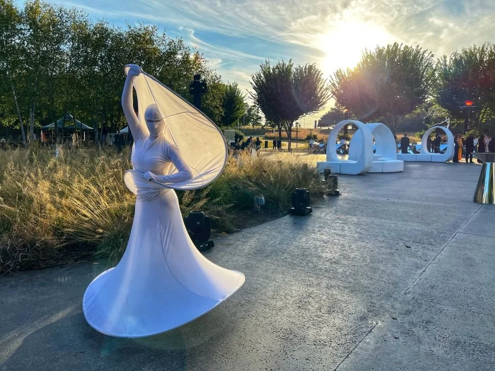 White Spiral Performer in a Modern Sculpture Garden