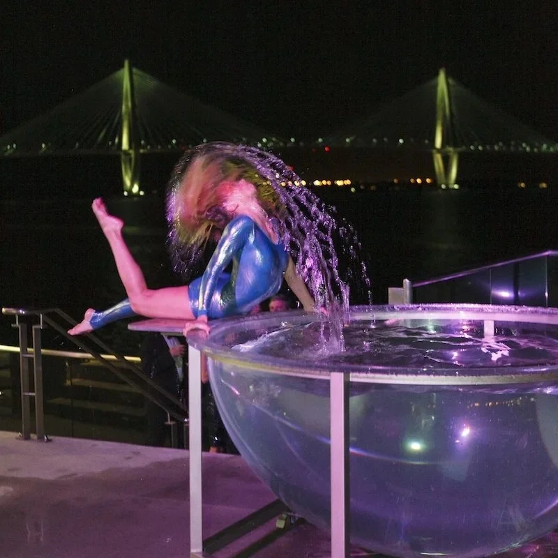 Water Bowl Performer Flipping Her Hair Mid-Splash