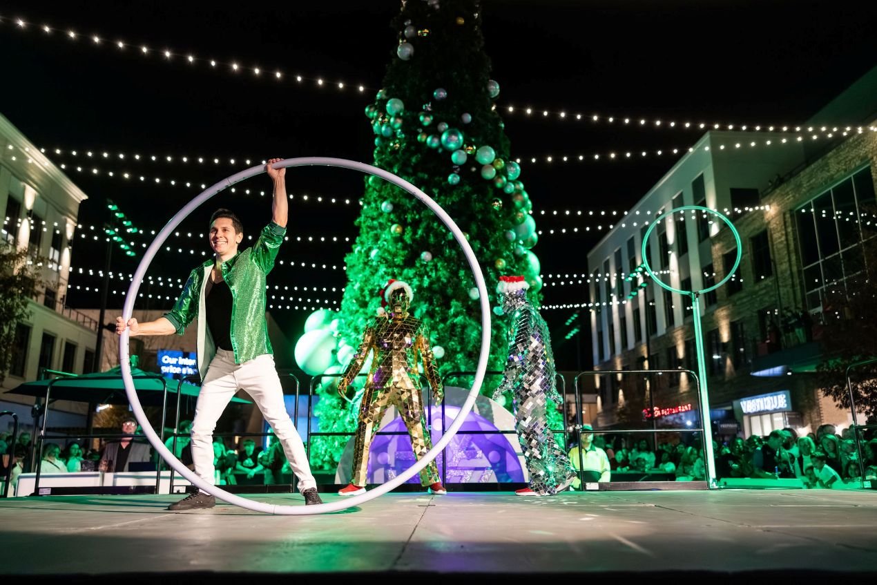Interactive Cyr Wheel Performance at Outdoor Holiday Tree Lighting in Raleigh, NC