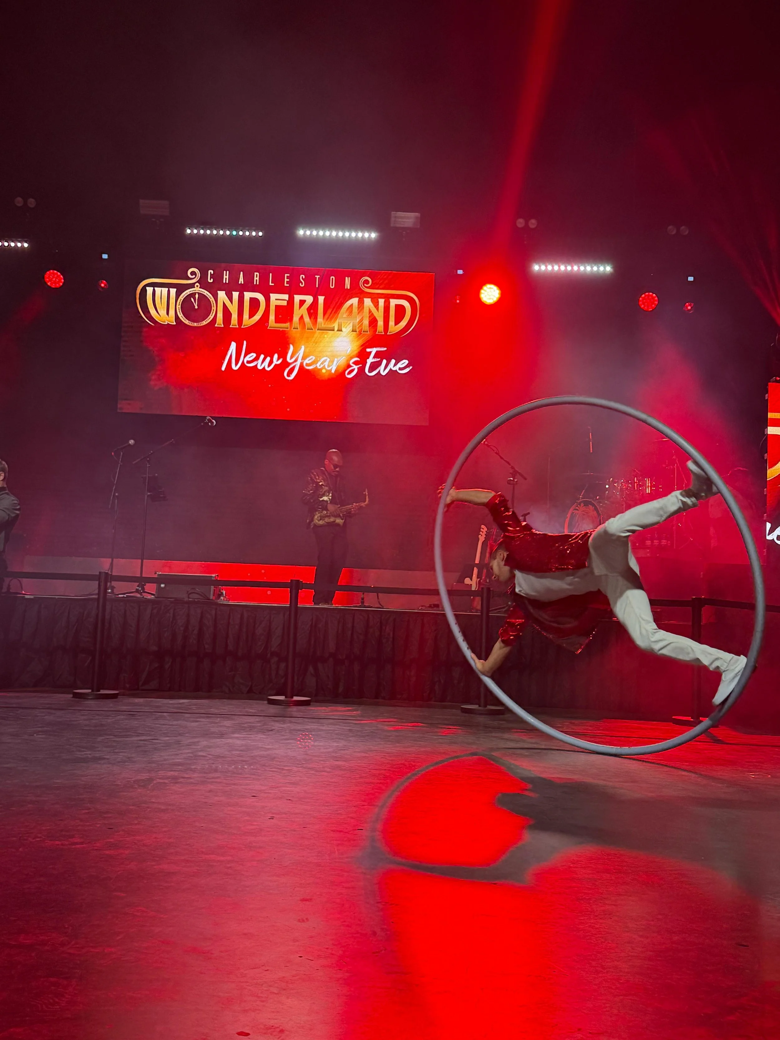 Interactive Cyr Wheel Performance at Red Themed New Years Eve Event in Charleston, SC