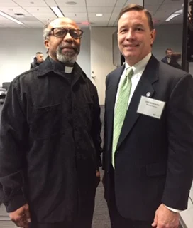 Rev. Killings with the regional director of the CFPB