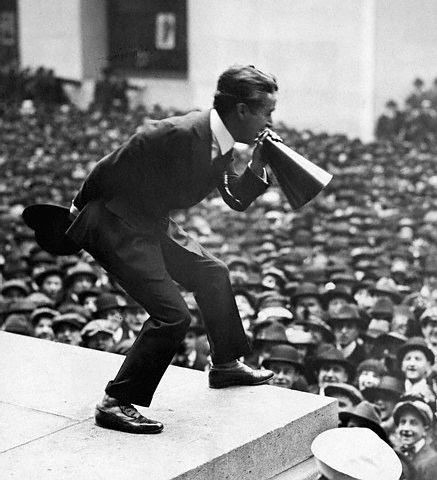 Chaplin riling up crowds for the war effort in a delightfully old-timey fashion.
