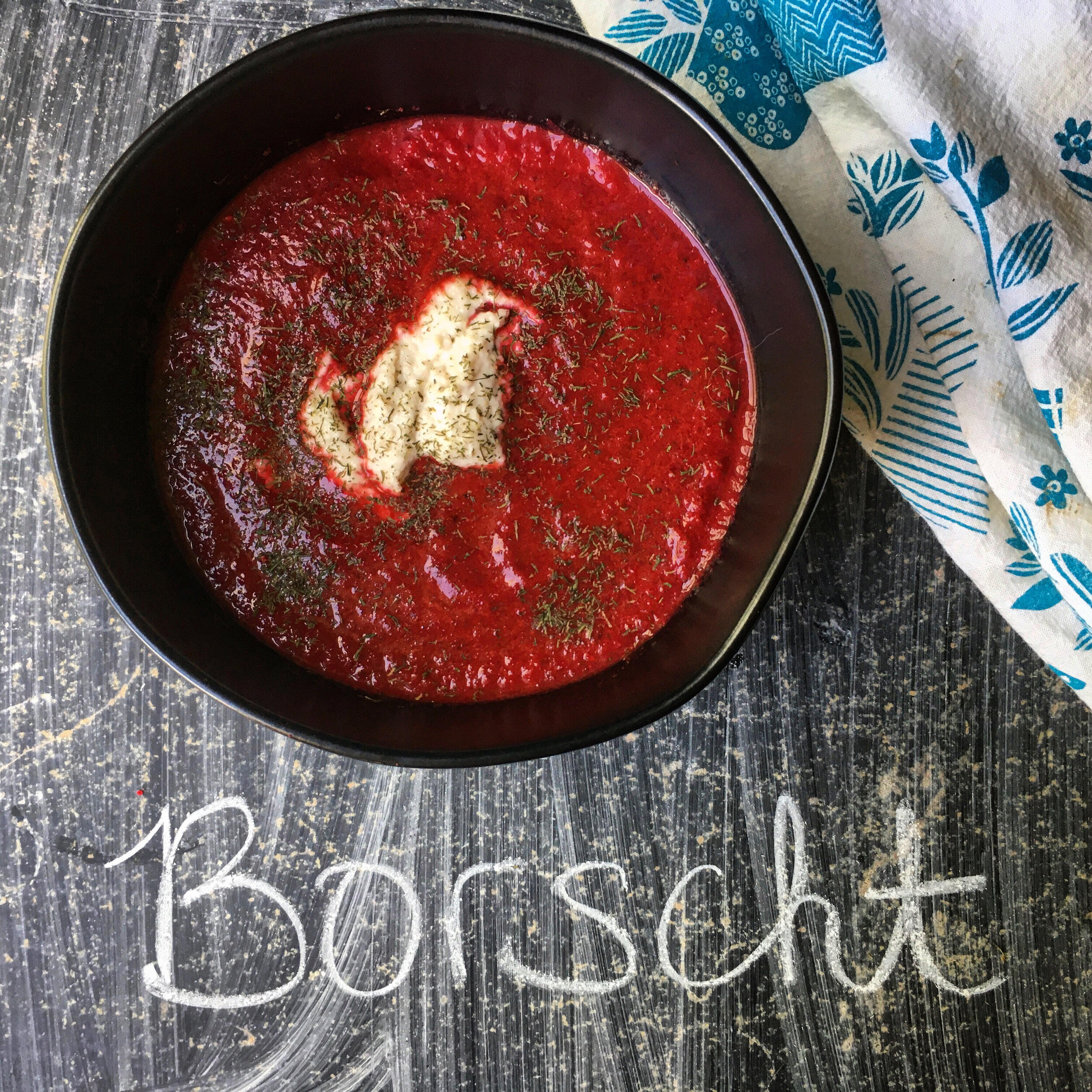 Borscht topped with cashew cream and dill