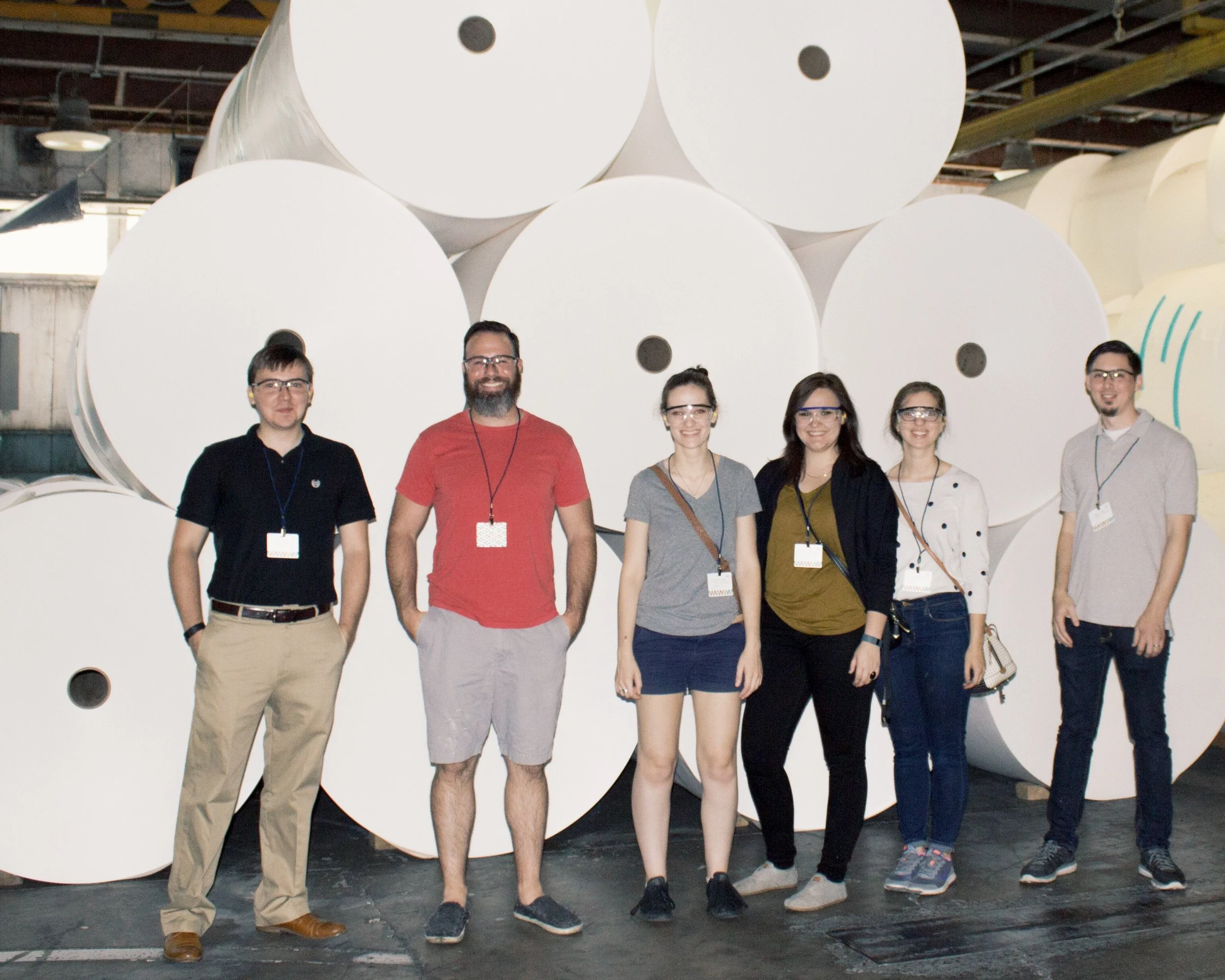 Our tour group in front of the huge rolls of the finest Mohawk paper. Photo taken by Ariel Smullen.