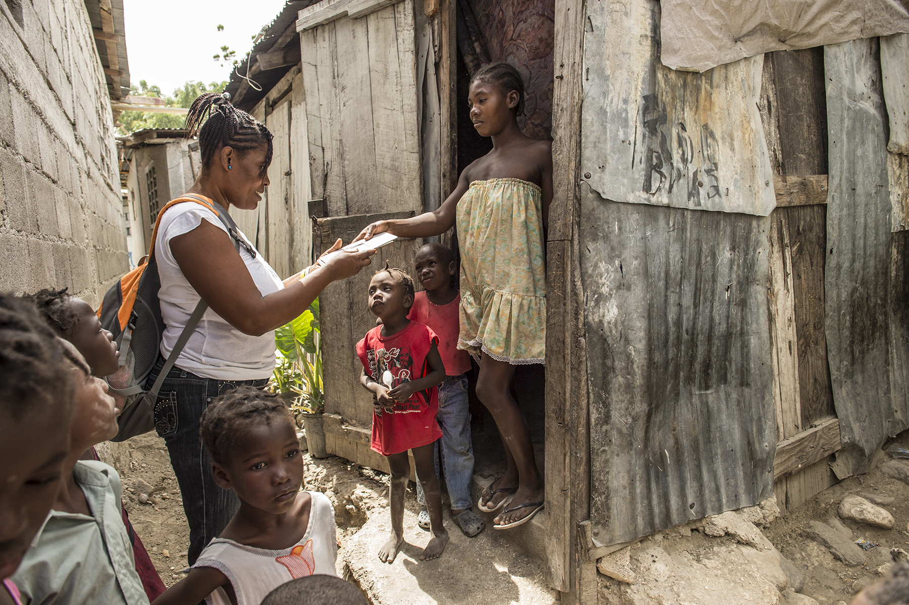 Door-to-door outreach in Cite Soleil