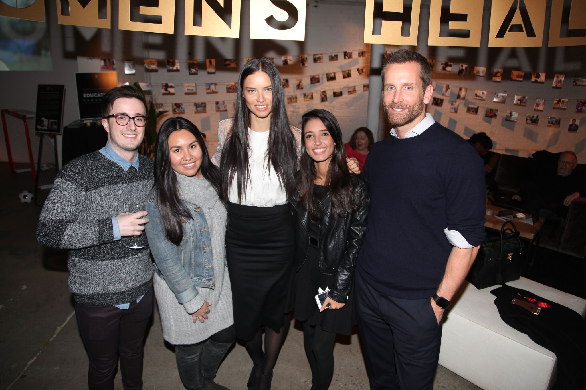 Attendees of the New York City fundraising party join St. Luke supporter Adriana Lima