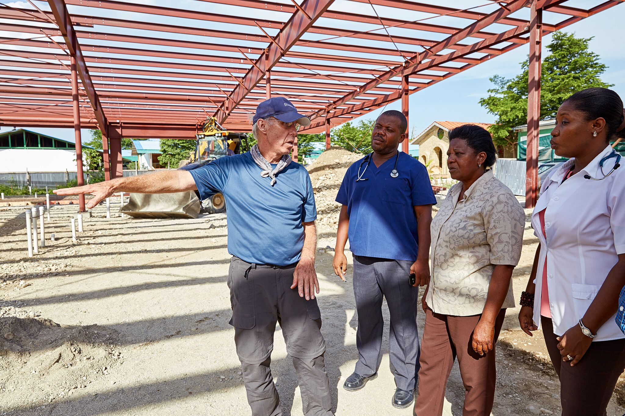 Advisory Board member Jim Corcoran consults with hospital staff on construction of the new medical facility