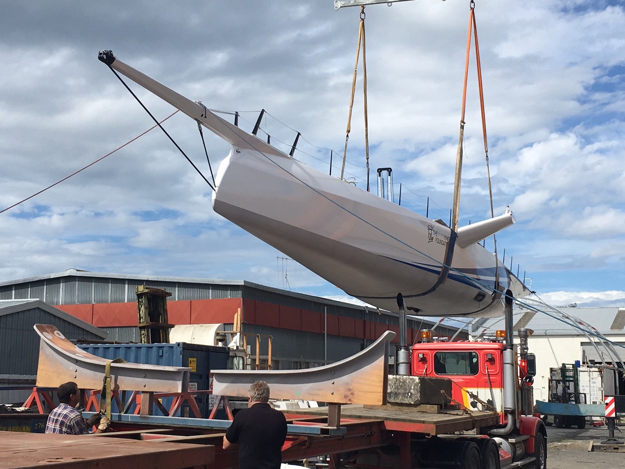 Yacht being lifted on to the truck before being transported to the docks ahead of launch.