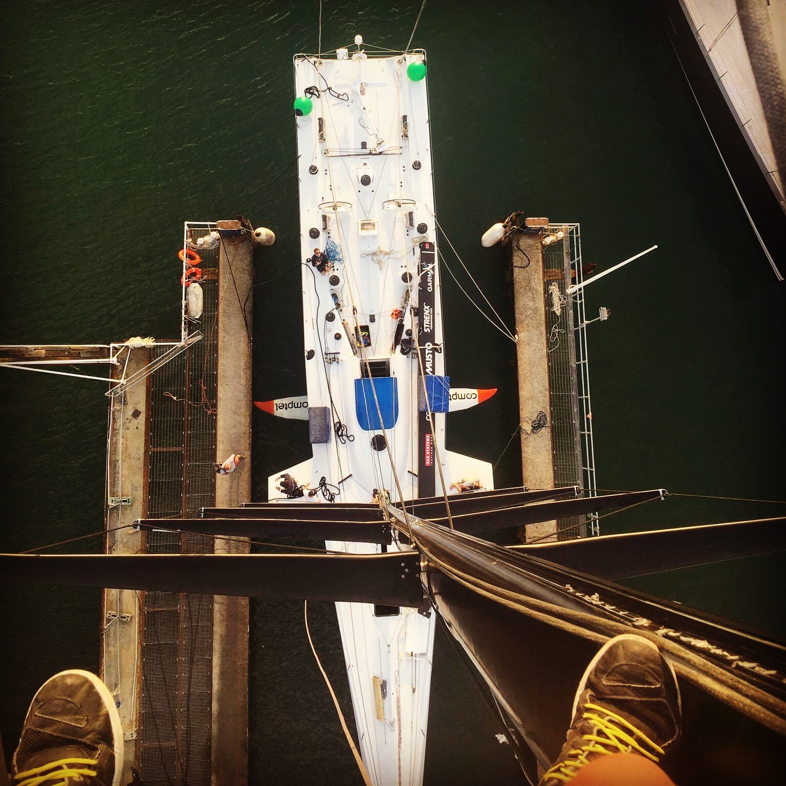 Up the mast with crew member Alan Turner