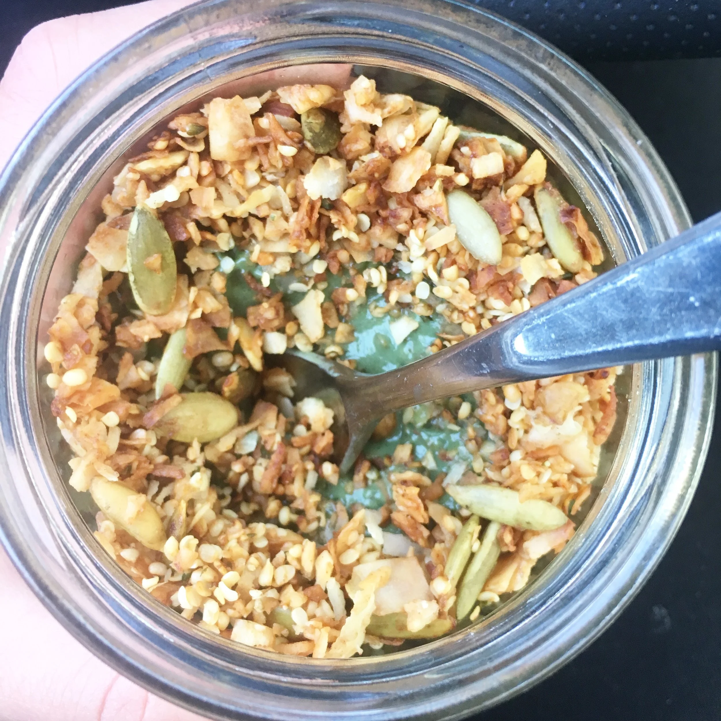 You can absolutely eat this granola by itself as an awesome snack. It also makes a yummy topper for yogurt and smoothie bowls, as pictured here.