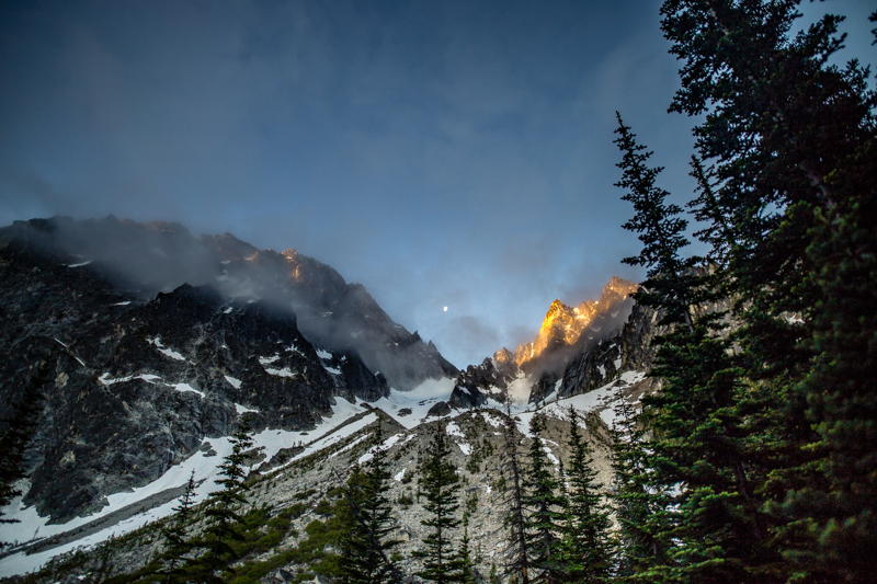The sunrise just catching Colchuck Peak while the moon still shines
