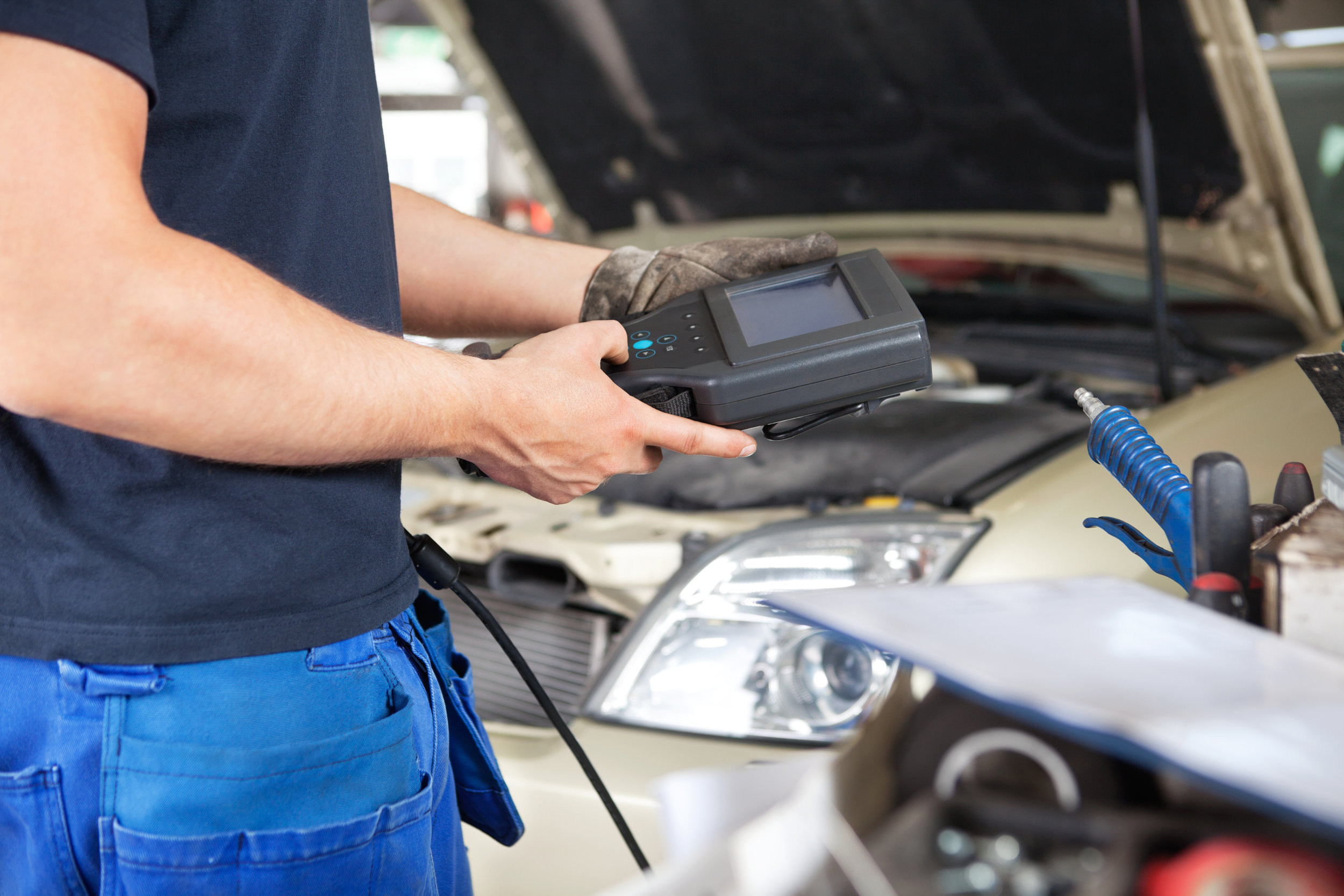 Mechanic using a Diagnostic Tool