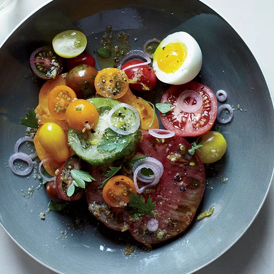 These Food & Wine Daily recipes look AMAZING!!!! Healthy & Delicious: This warm, garlicky anchovy dressing here is fantastic with an assortment of juicy, peak-season tomatoes. To finish the dish, Amelia O’Reilly and Nico Monday top it with tangy pickled shallots and an oozy, soft-boiled egg. Recipe!