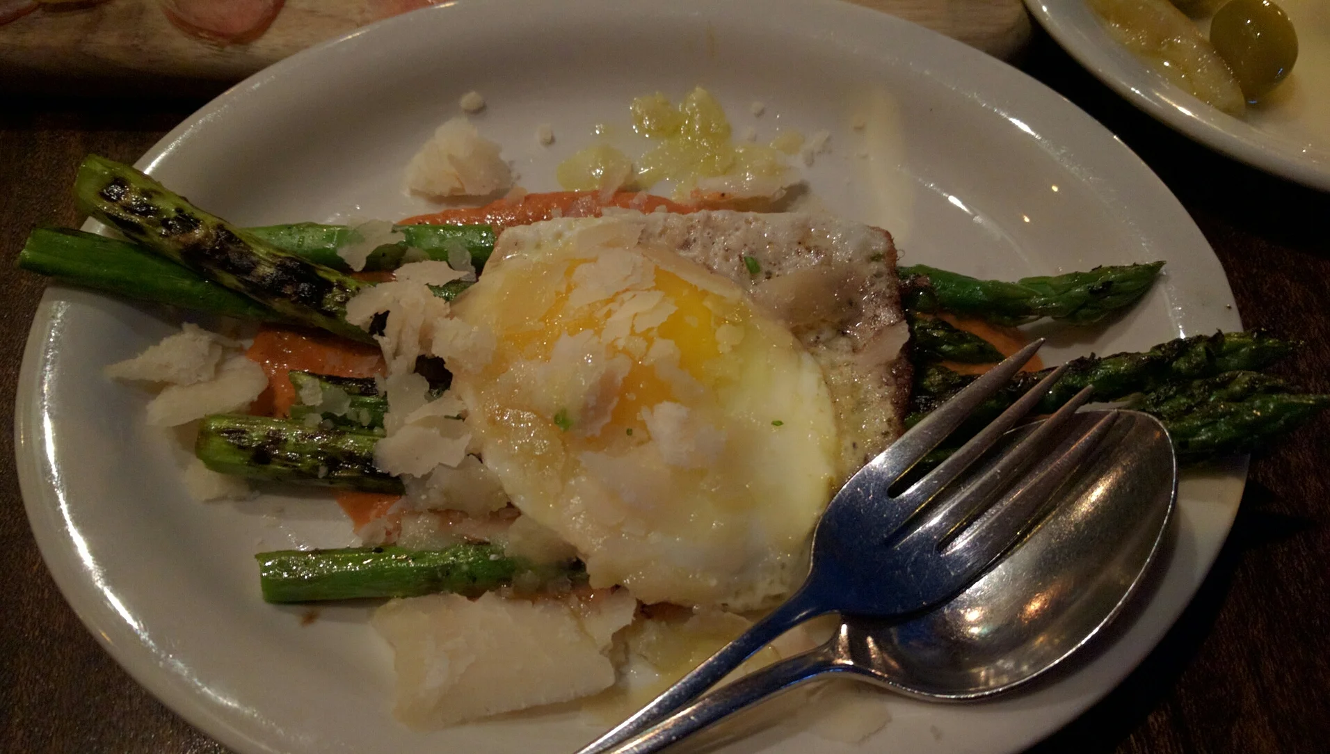 The roasted asparagus are divine, accompanied by manchengo, a tomato cream sauce, and topped with a fried egg.&nbsp;