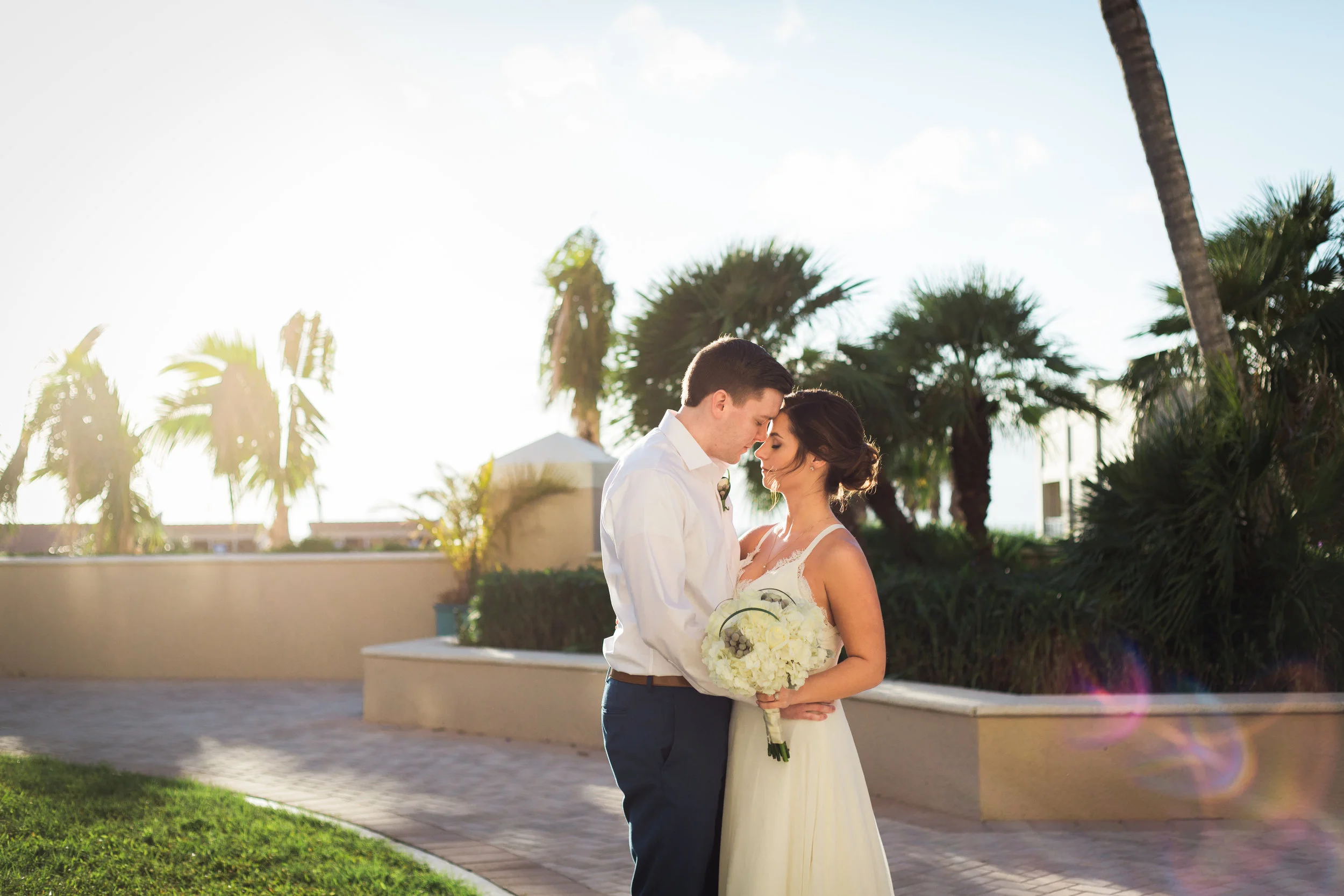 Beautiful, sunny, and intimate Florida beach wedding at Sunset. Documentary Wedding photographer for the genuine couple in love.