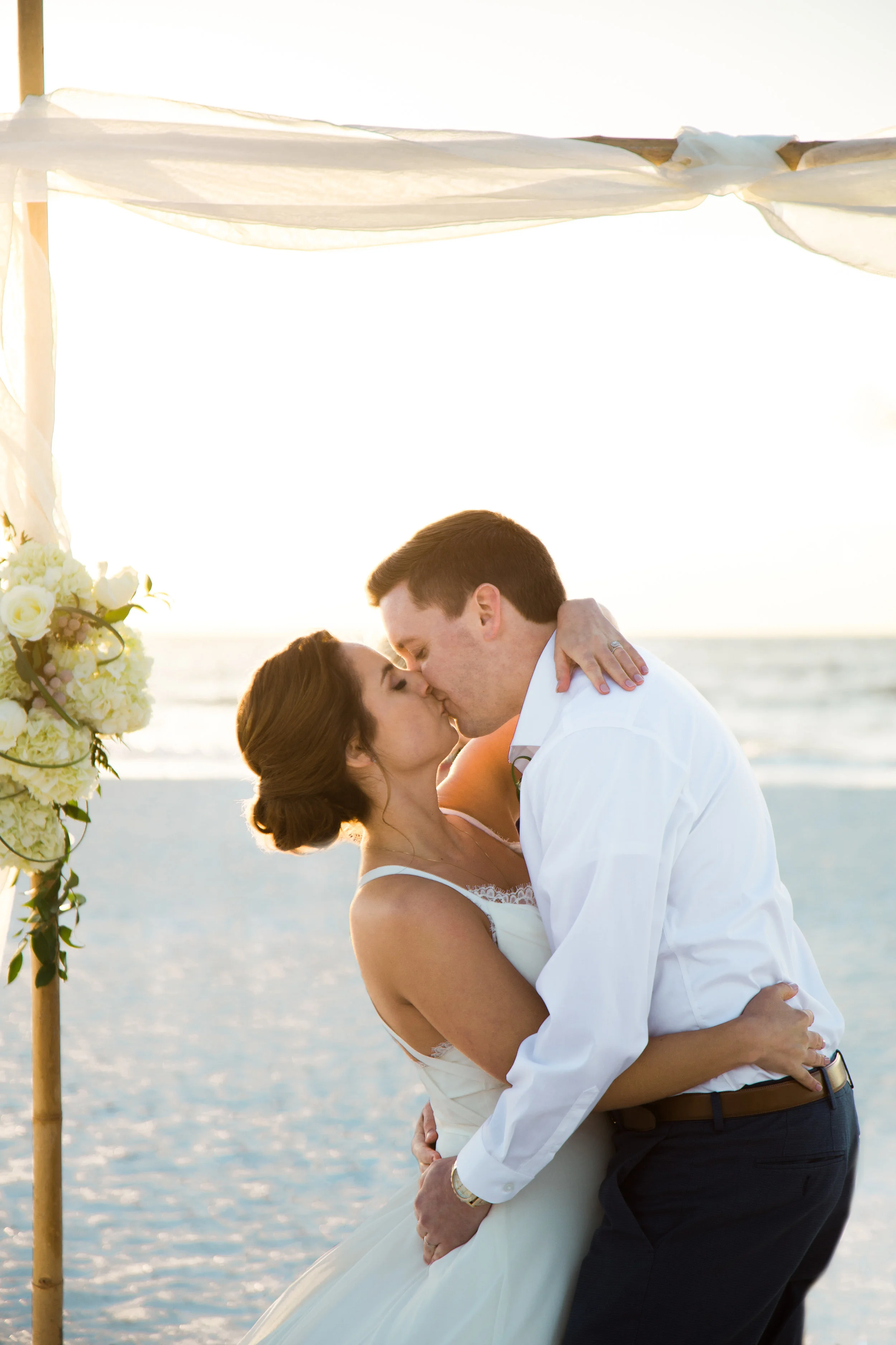 Beautiful, sunny, and intimate Florida beach wedding at Sunset. Documentary Wedding photographer for the genuine couple in love.