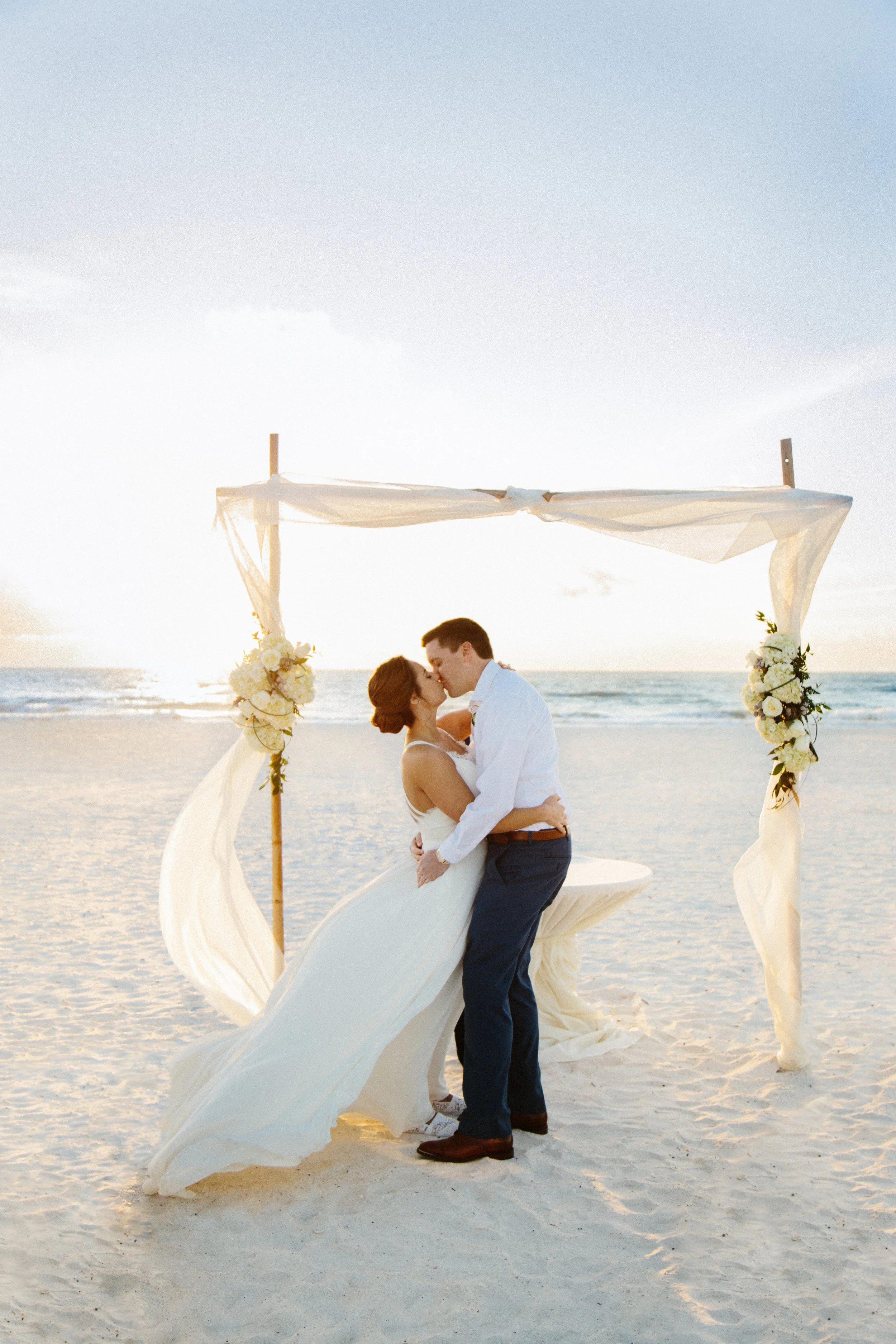 Beautiful, sunny, and intimate Florida beach wedding at Sunset. Documentary Wedding photographer for the genuine couple in love.