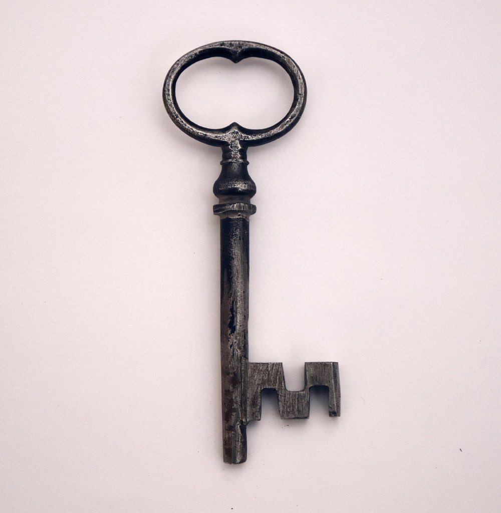 An antique metal key