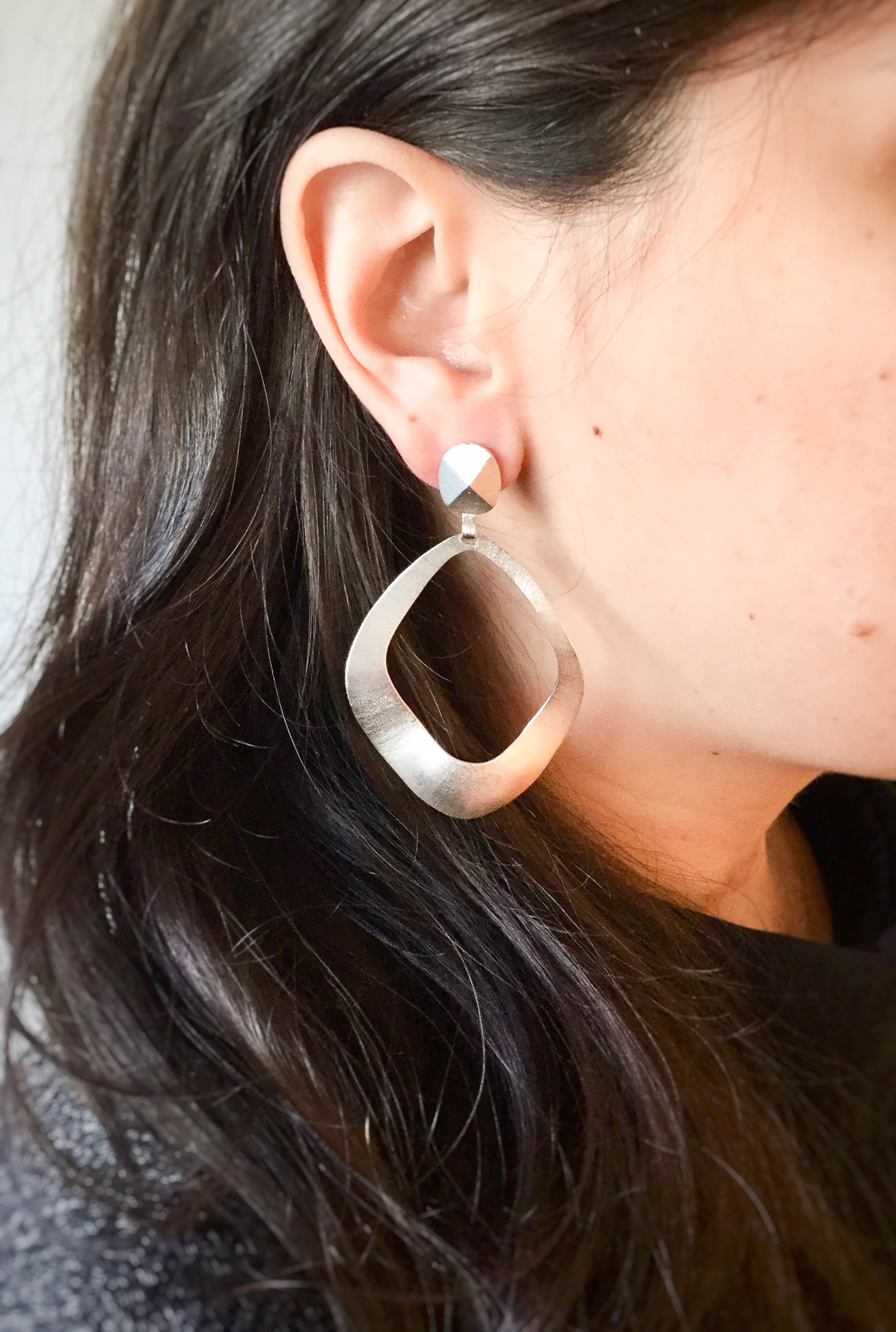 Big Apple Earrings Model.jpg