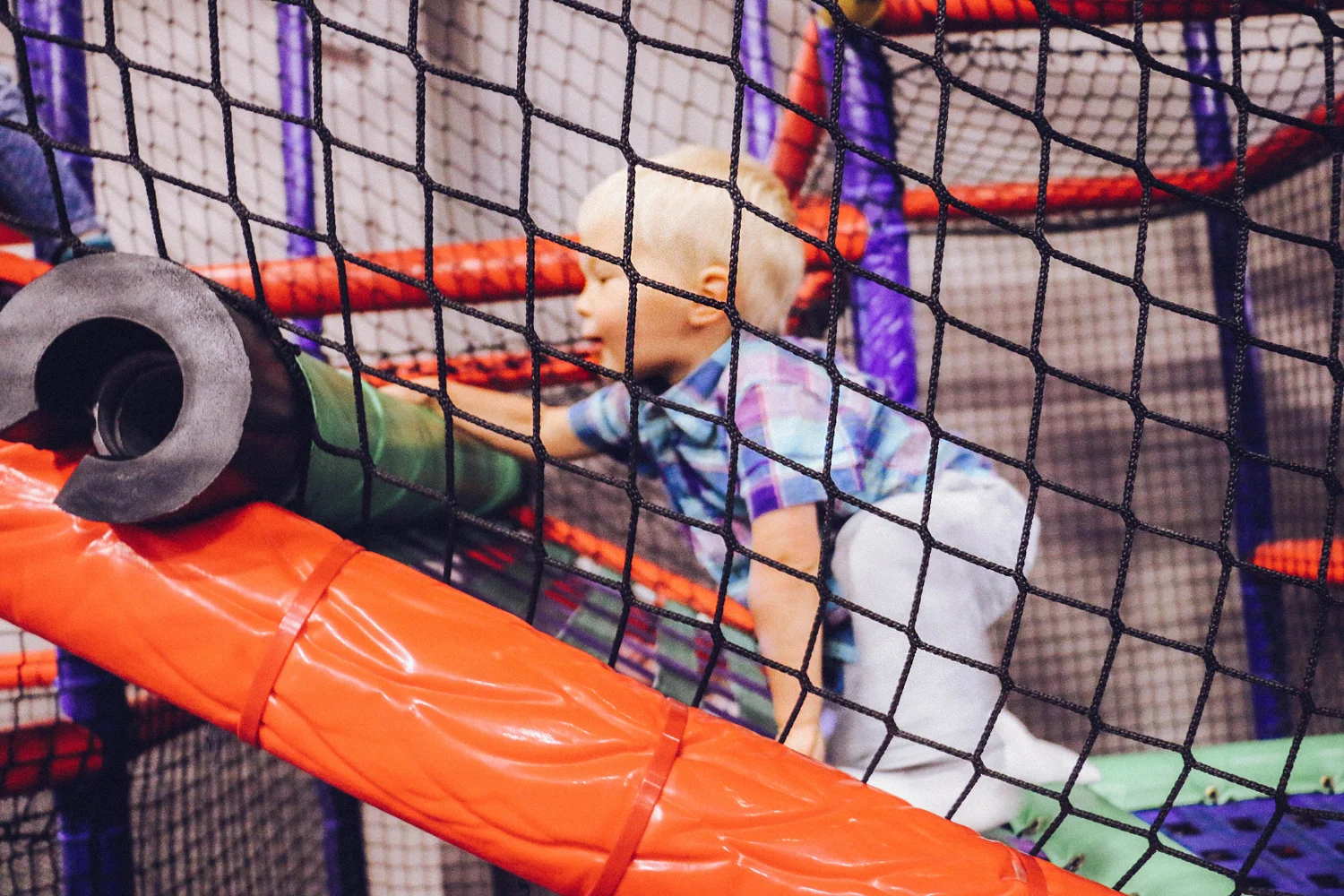  Small child Climbing at classic fun center 