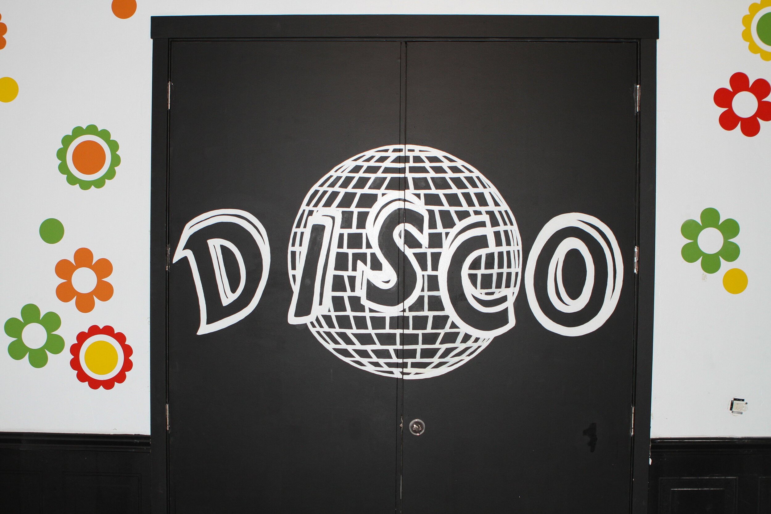  double doors with disco written on them 