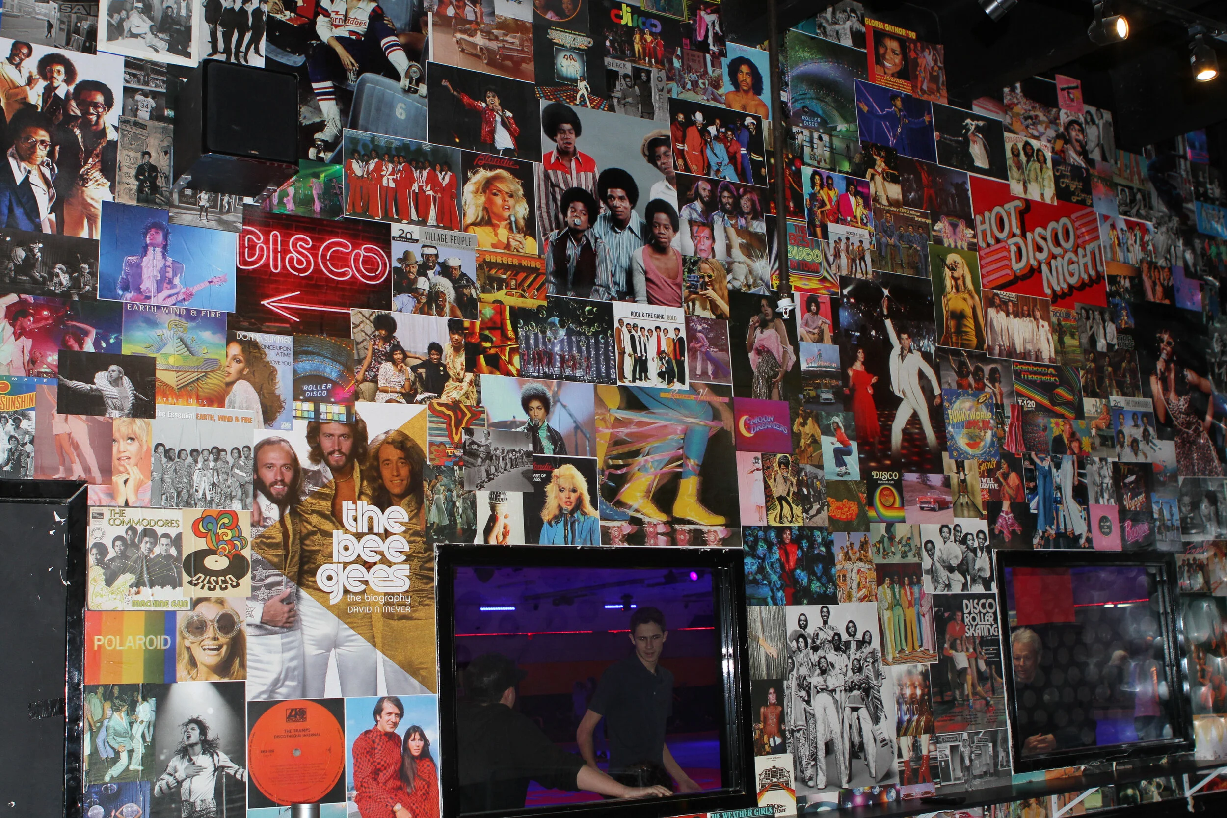  collage wall with an inside window looking over a skating rink 