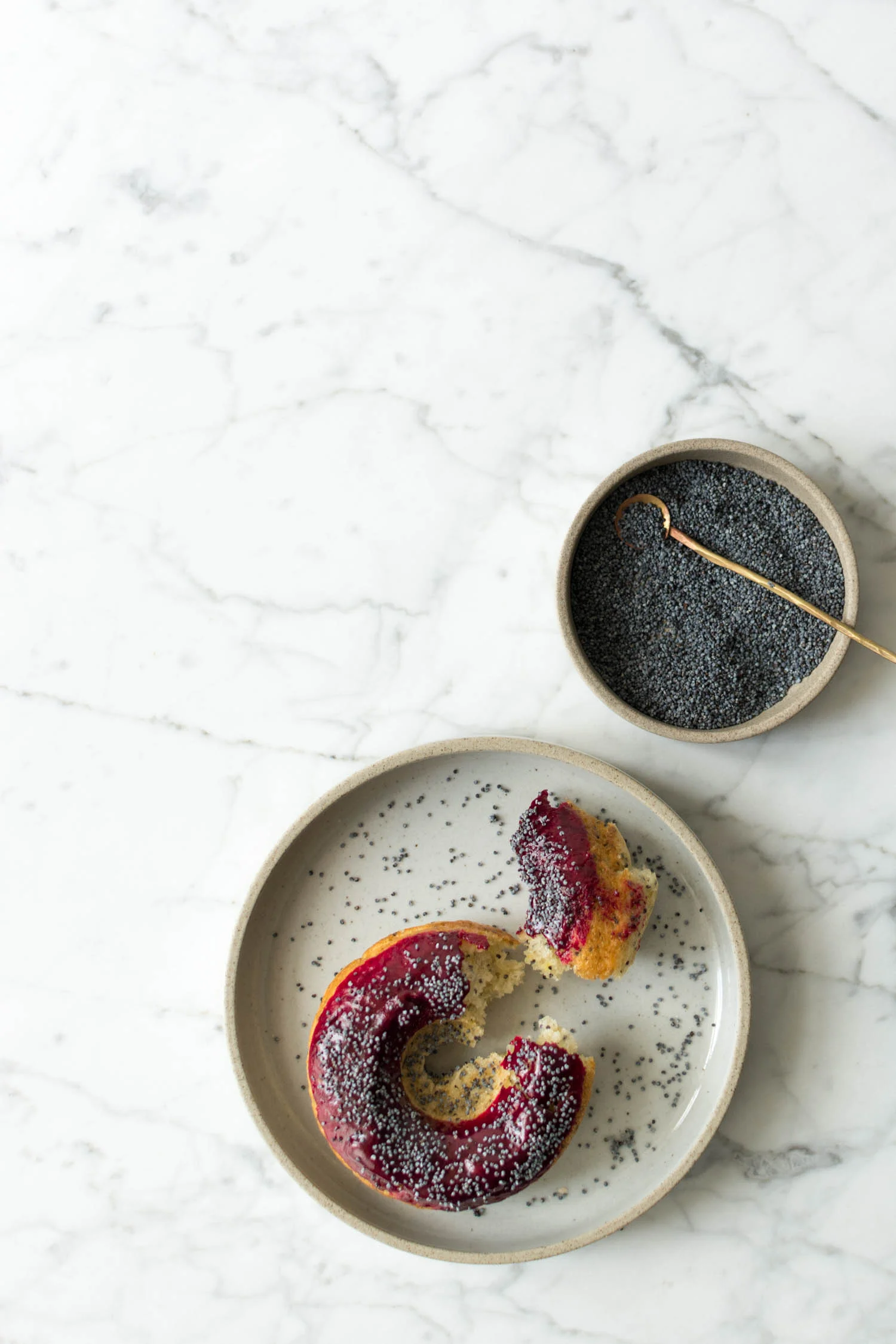 baked lemon poppy seed doughnuts w/ blackcurrant glaze
