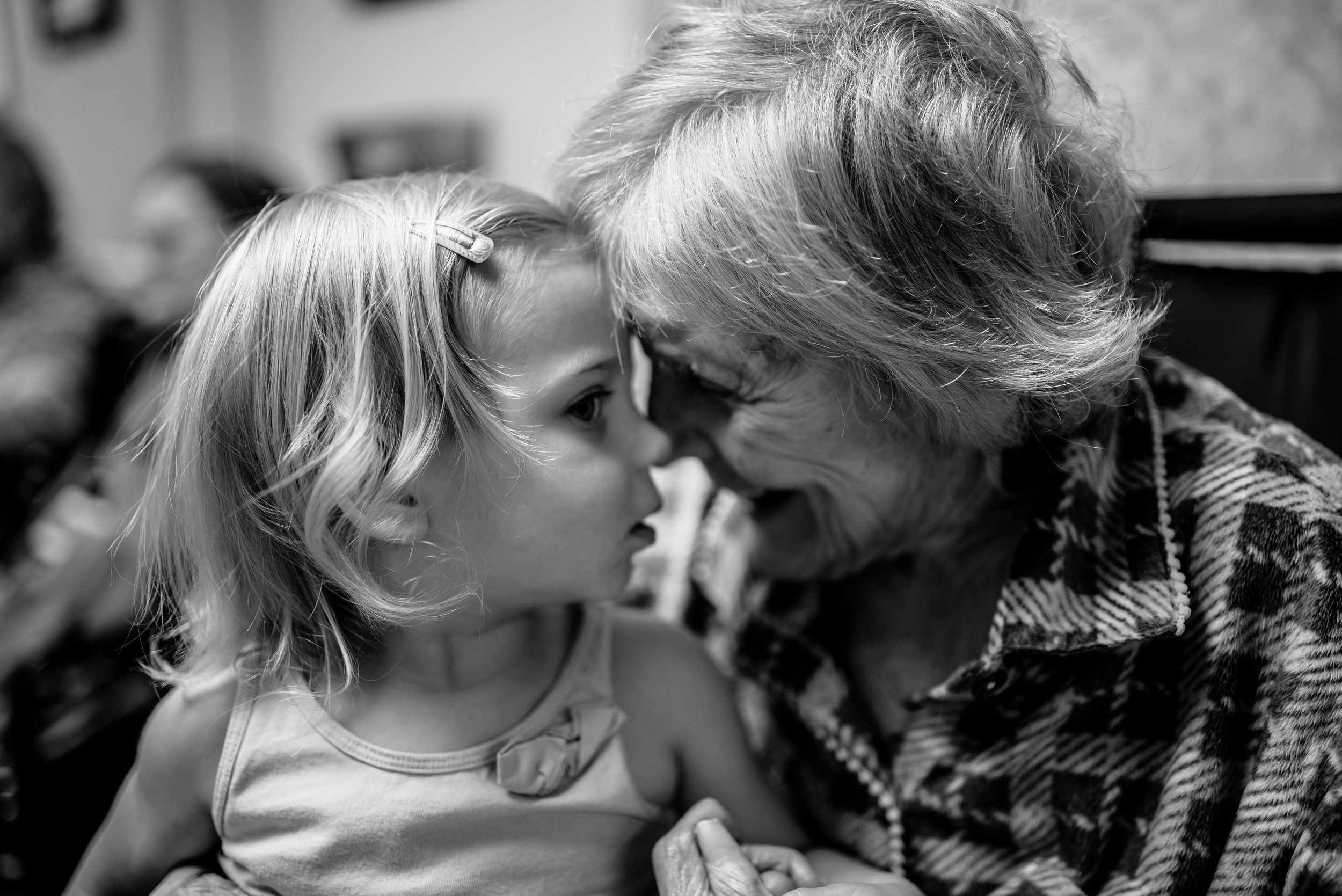 girl and great-great-grandmother look at each other