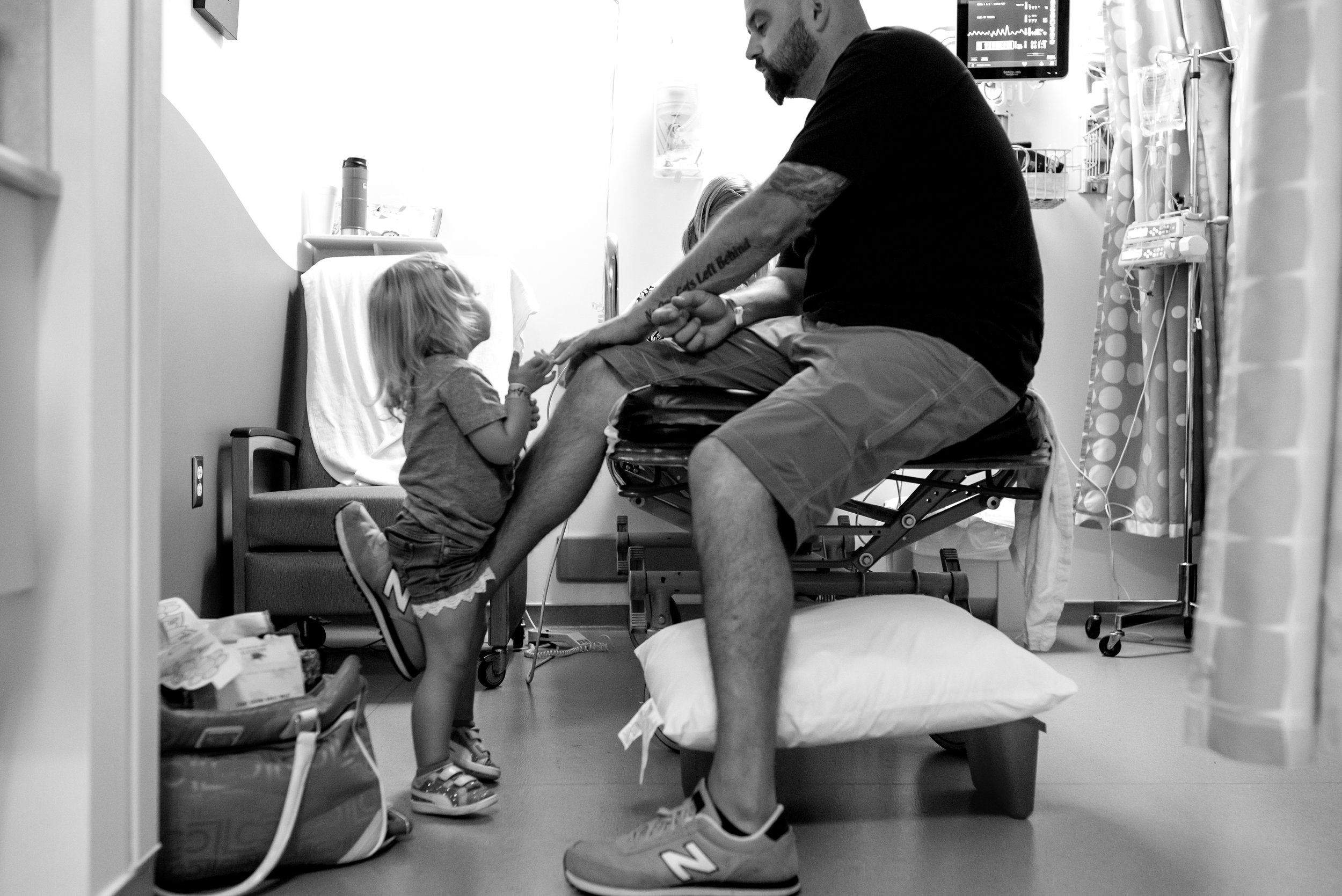 Dad plays with daughters in hospital