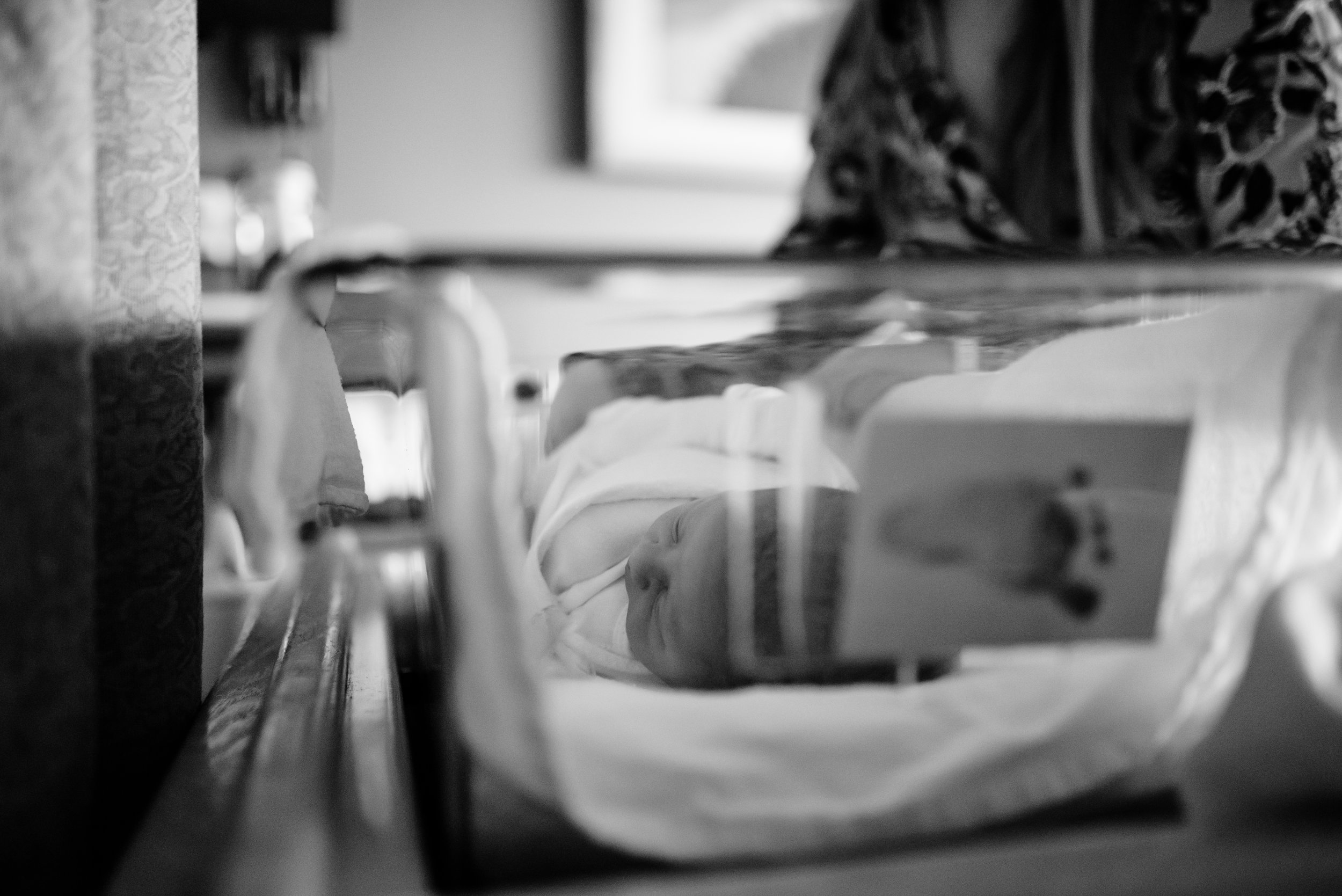 Newborn in bassinet at hospital