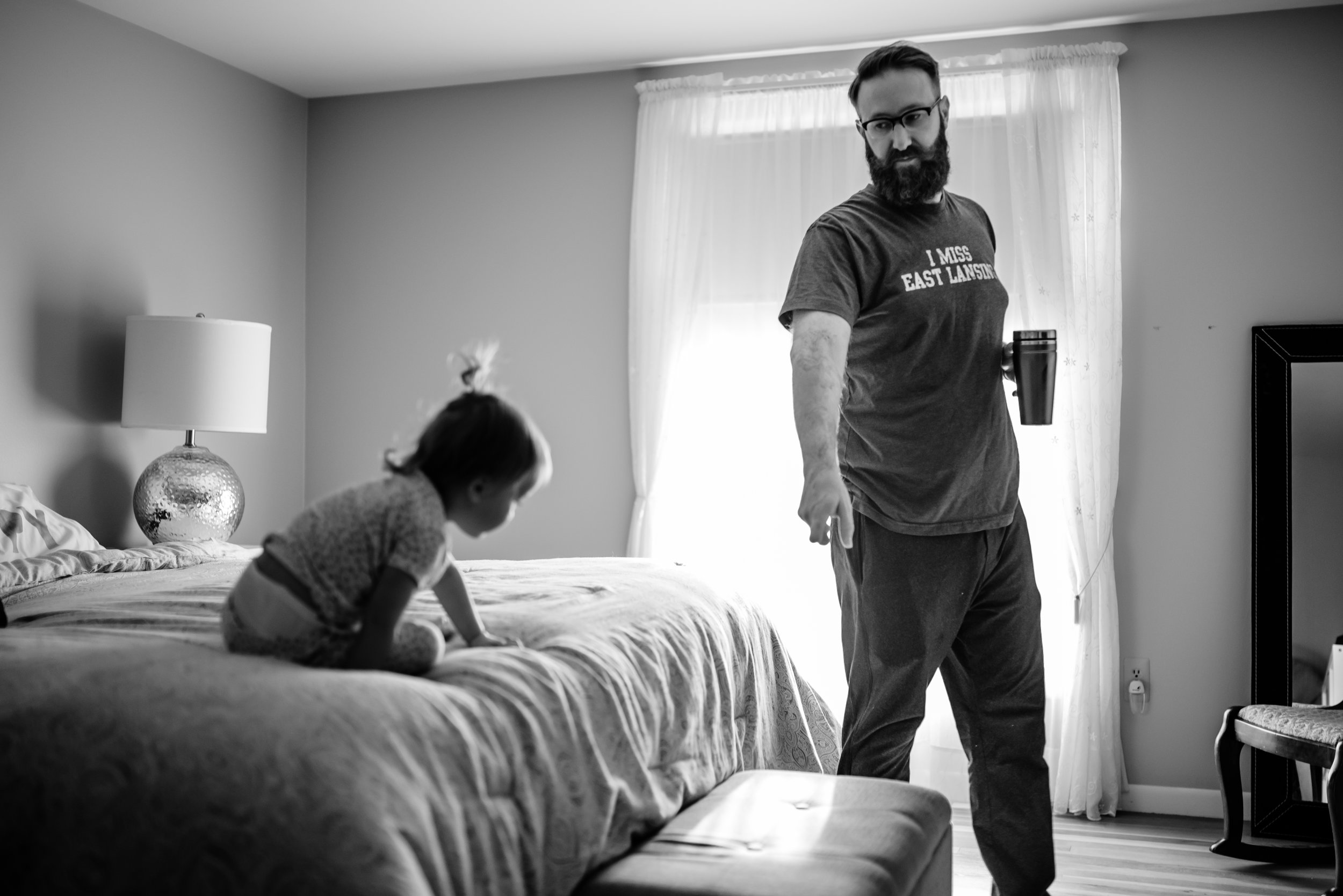 Dad points to tell daughter to how to get down off of bed