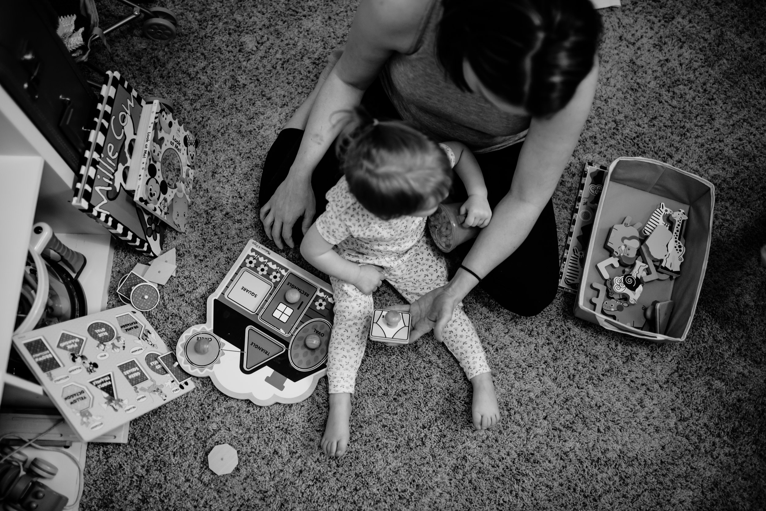 Mom and daughter play puzzles