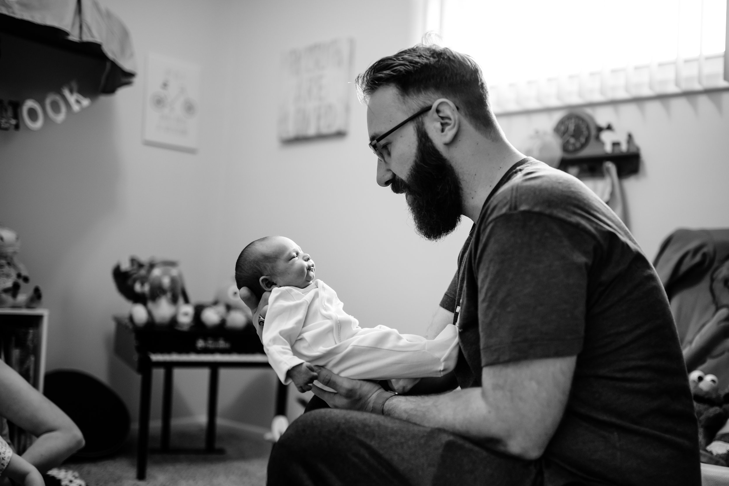 Dad admires baby