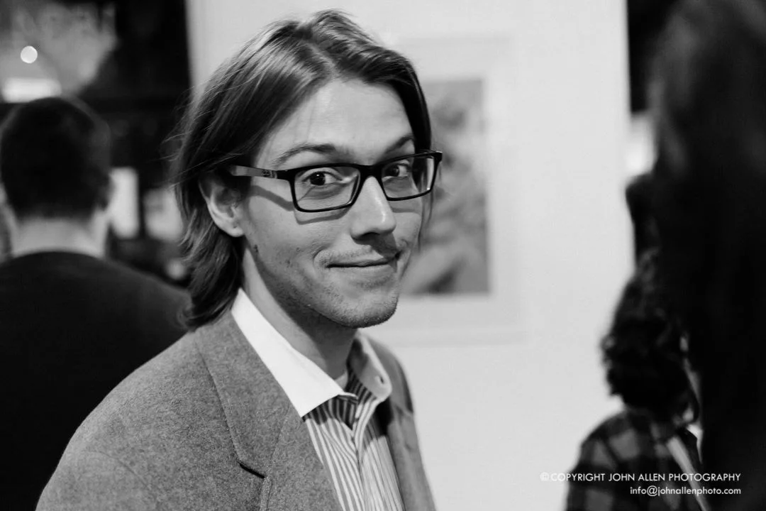 Lucas Sams was born and raised in Greenwood, South Carolina and in 2006, Sams left home to live and study at the South Carolina Governor’s School for the Arts and Humanities in Greenville. Prior to attending the Governor’s School, Sams had worked primarily with illustrations, graphic arts, and ceramics. Upon graduation from the Governor’s School, Sams traveled to Tokyo where he studied painting at the Temple University Tokyo Campus. His major professor there was the Brazilian-born eco-artist, Walderedo De Oleveira. De Oleveira taught Sams the technique that he most often uses in his work today. After returning to the US in 2008, Sams enrolled at the University of South Carolina and began working on an undergraduate degree.