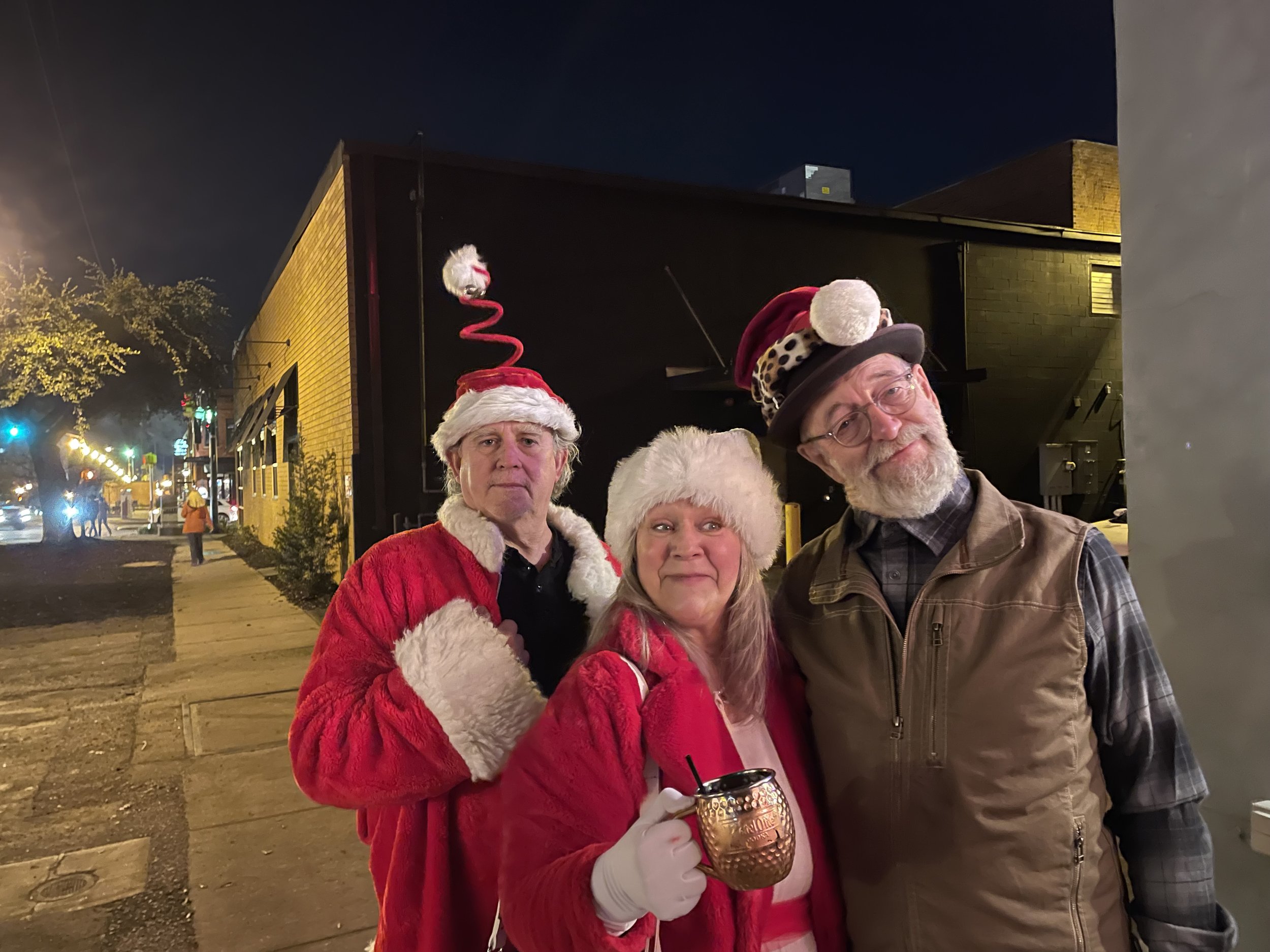 Jasper Friends Dick Moons and BA Hohman pose with our host, Clark Ellefson, outside the Art Bar during our Santa Crawl