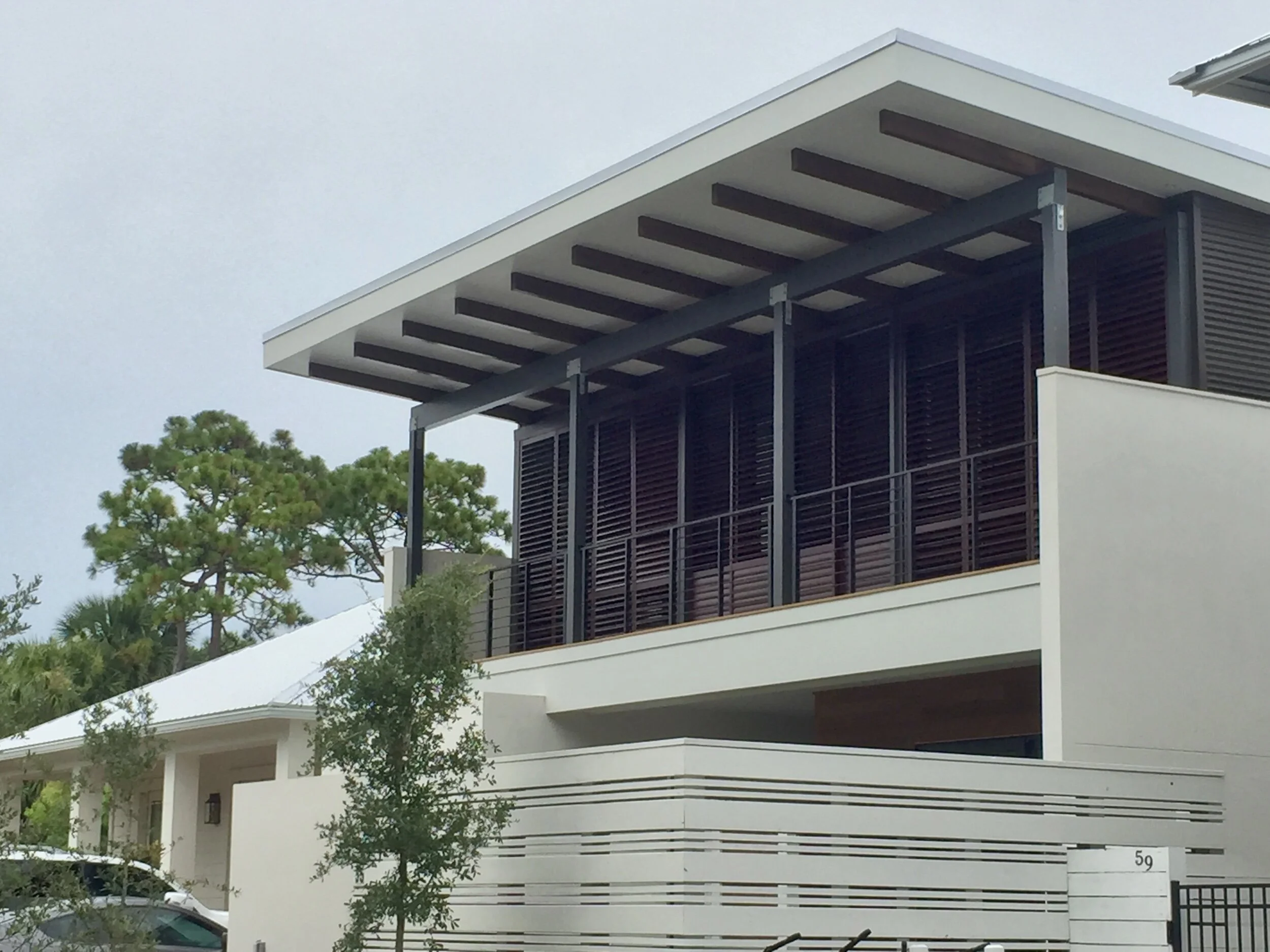 Ortez ResidenceThis modern home features a series of glue laminated roof beams running from front to back that provide both the structure and primary decorative feature of the house