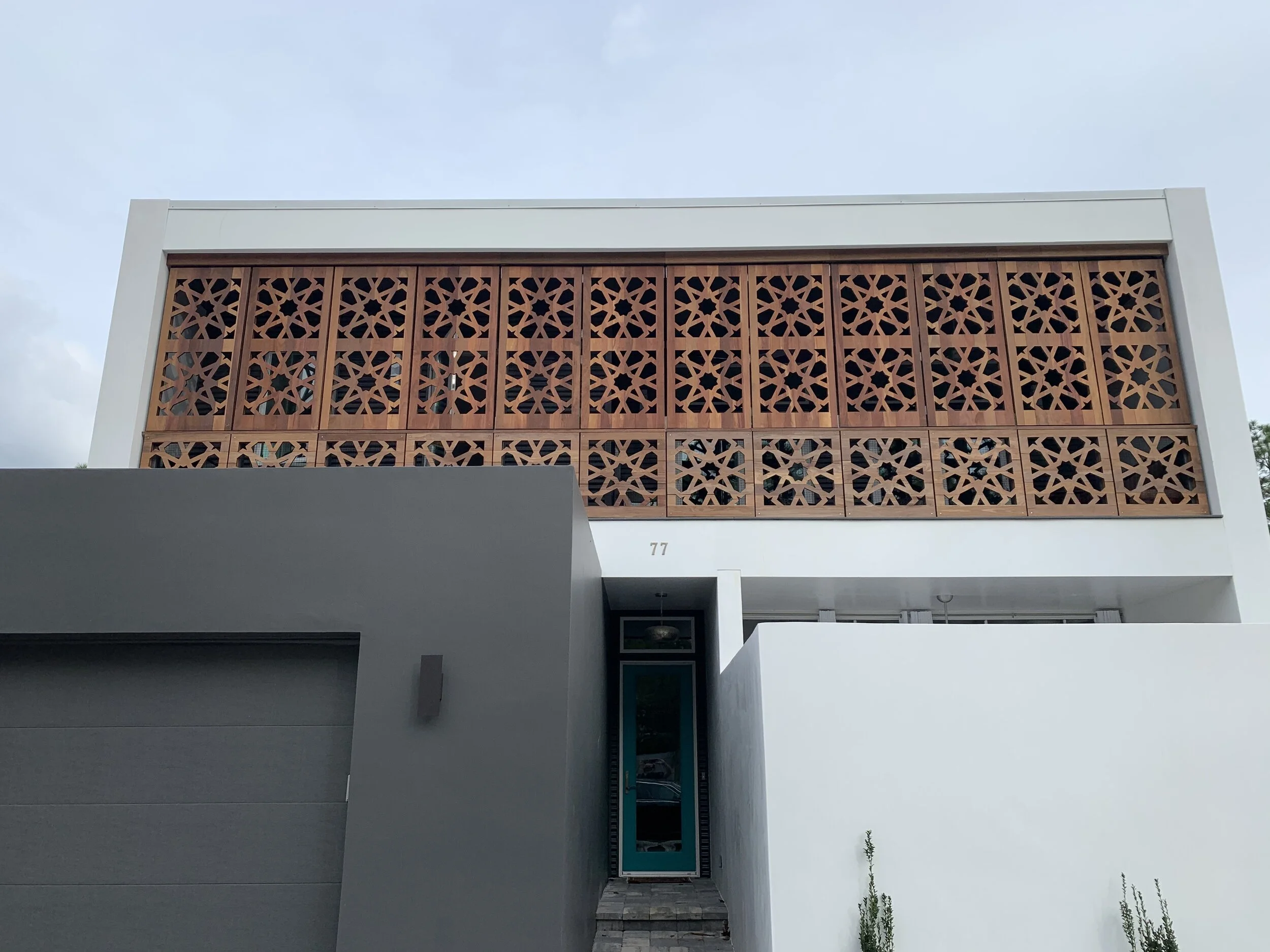 Glaeser ResidenceThis design is a modern interpretation of a Middle Eastern courtyard house which features multiple courtyards separated by a covered terrace. The home also features a Mashrabiya, or wooden screen on the second floor