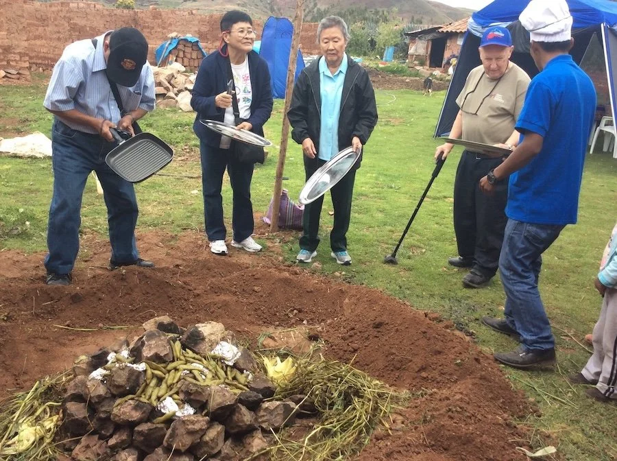 An image of people Making Pachamanca, Sacred Valley, Peru
