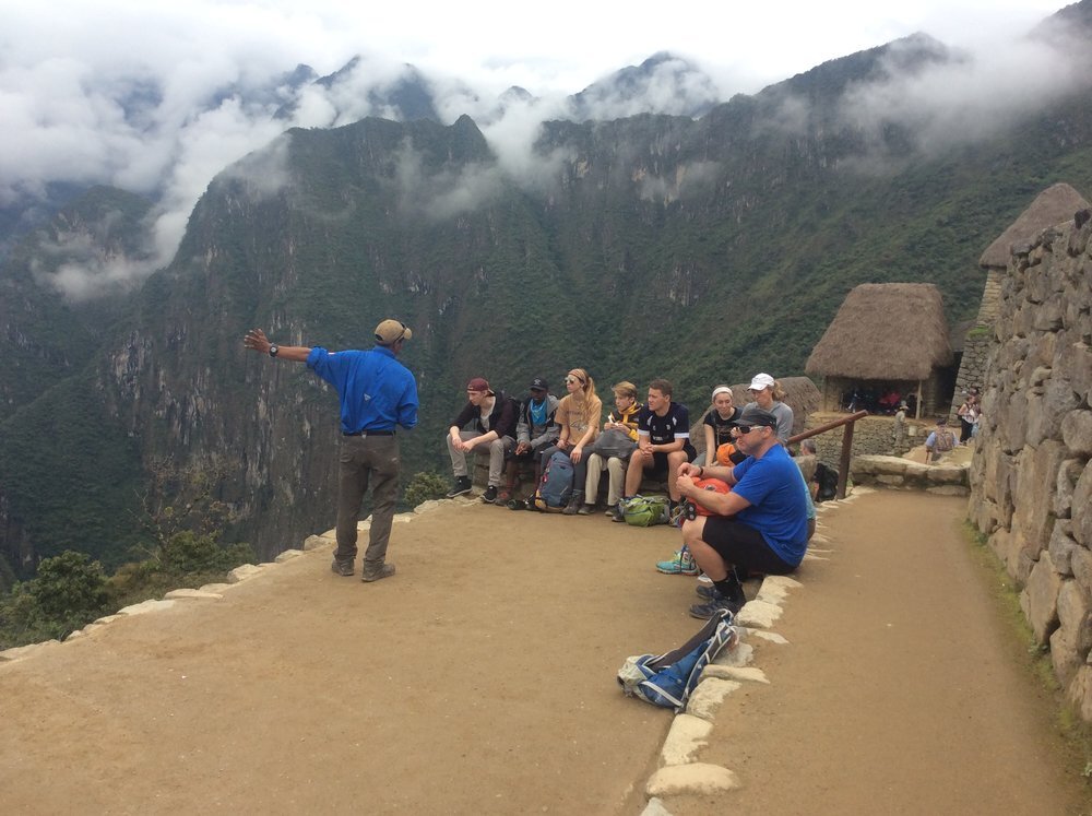 Guide explaining ruins, Inca Trail, Peru.jpg