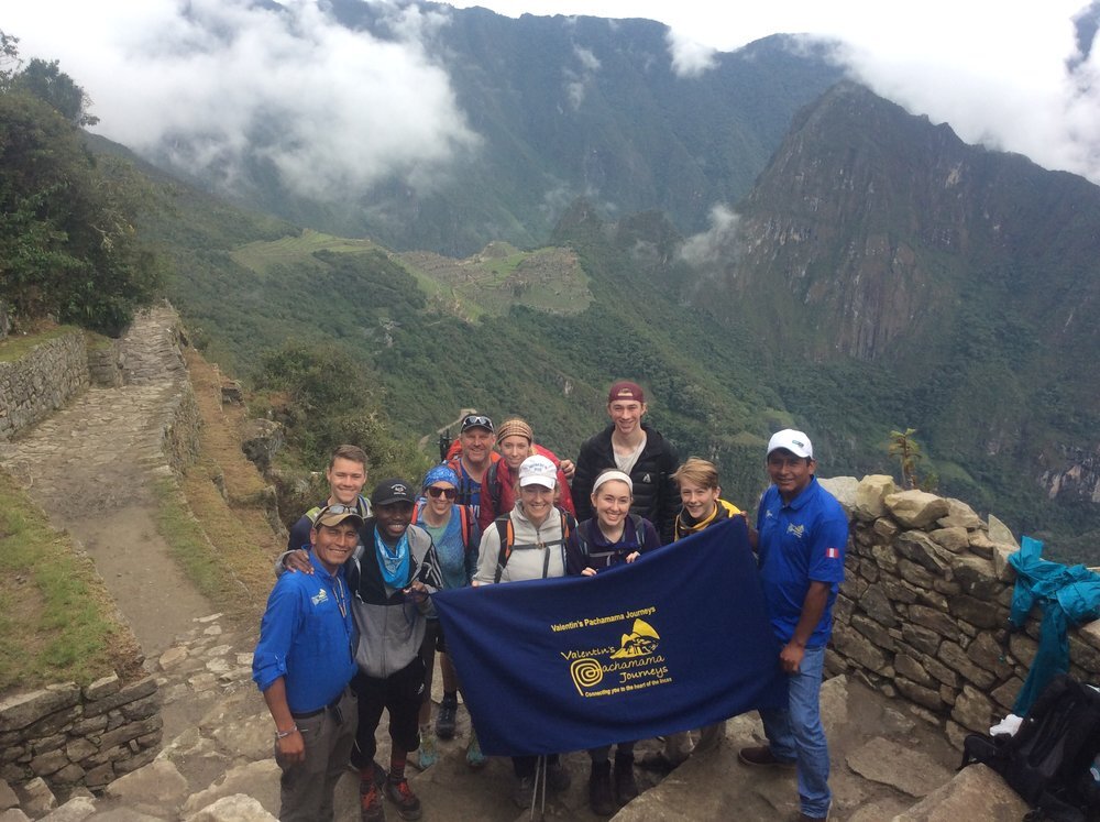 Inca Trail trekkers at the sun gate at Machu Picchu, Peru.jpg