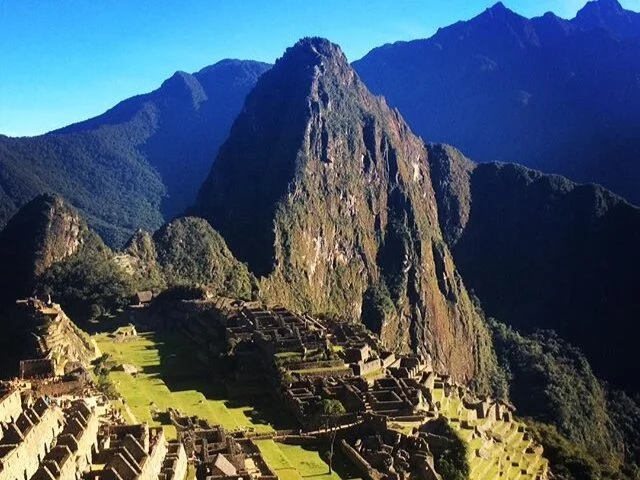 An image of Machu Picchu ruins in the sunshine, Peru