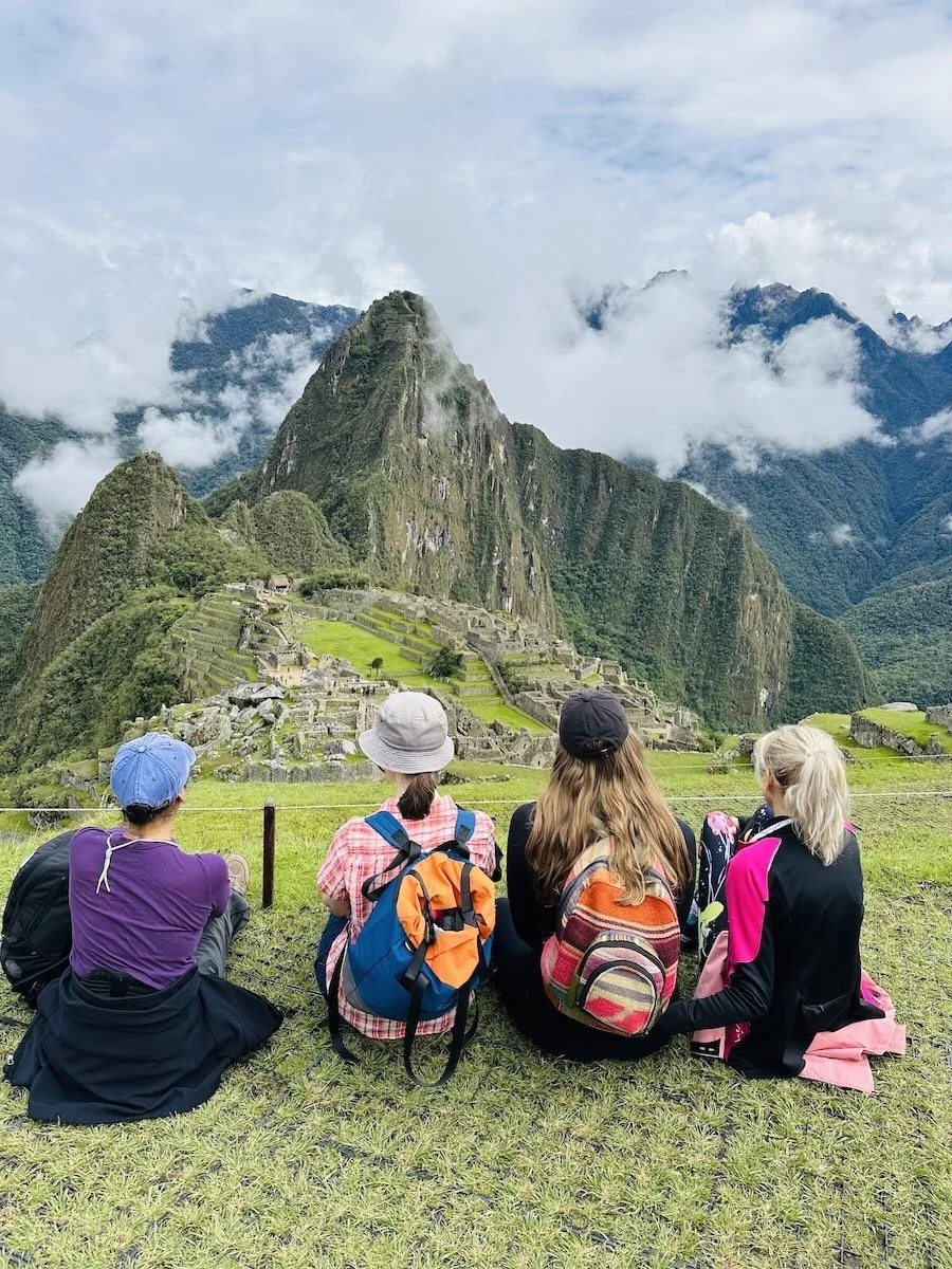 Family looking out at Machu Picchu ruins, Peru.jpeg