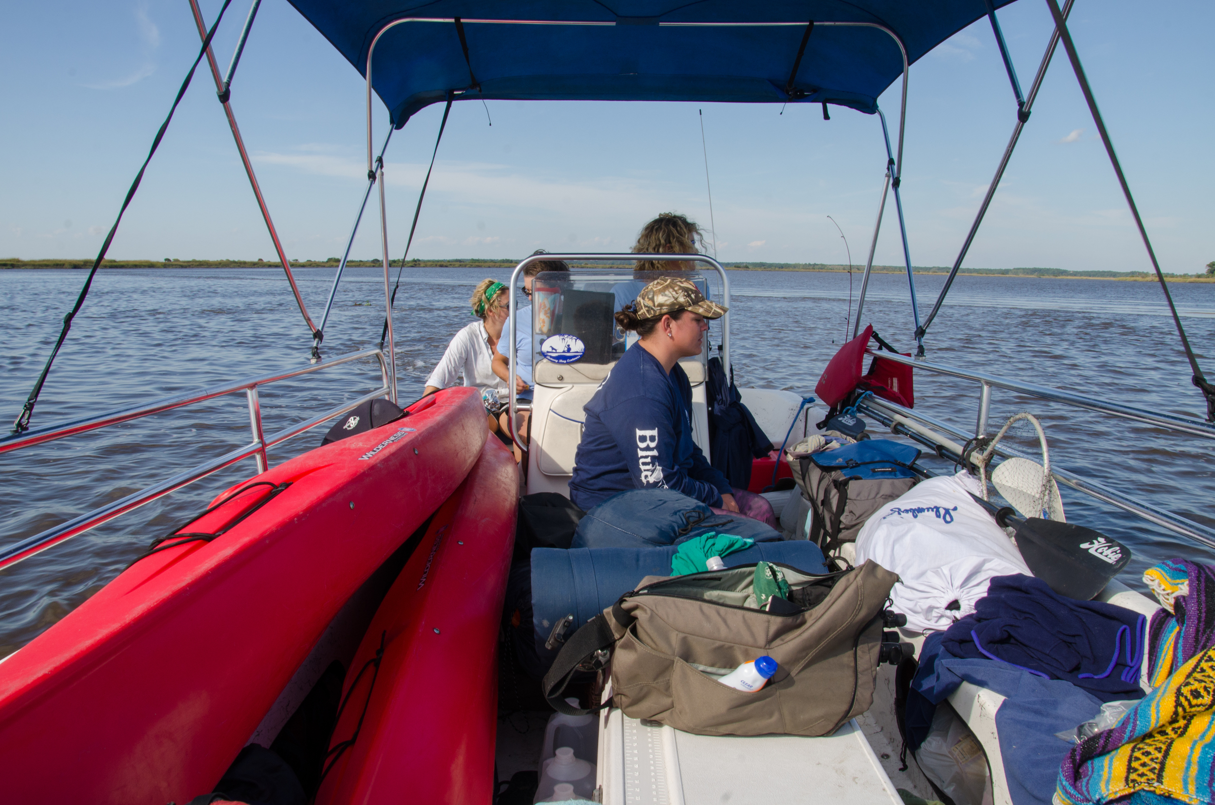 Kayaks and gear piled in the boat.