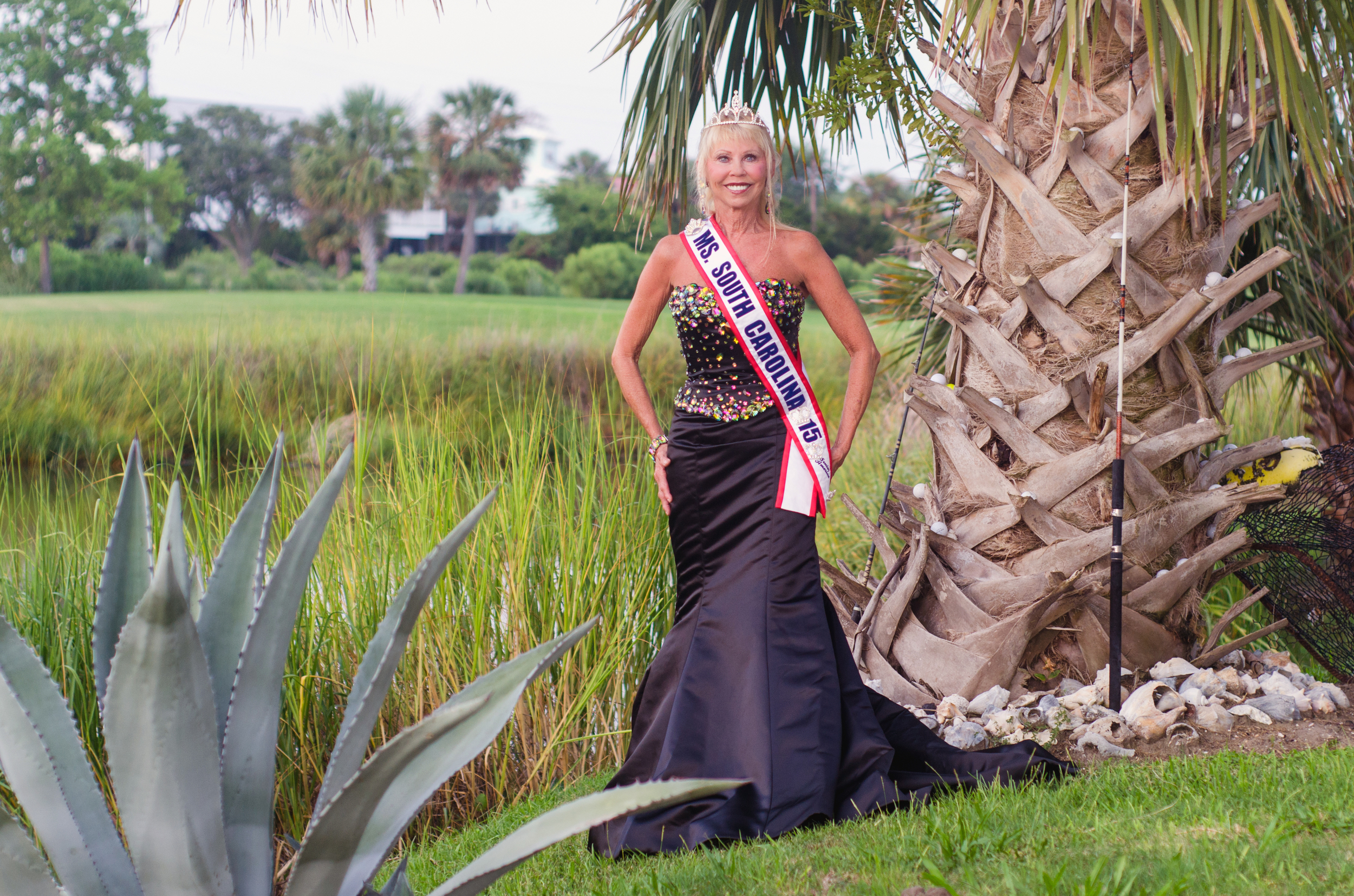 Becky Rose, Ms. Senior South Carolina, 2015 poses by the marsh grass and palmetto tree.